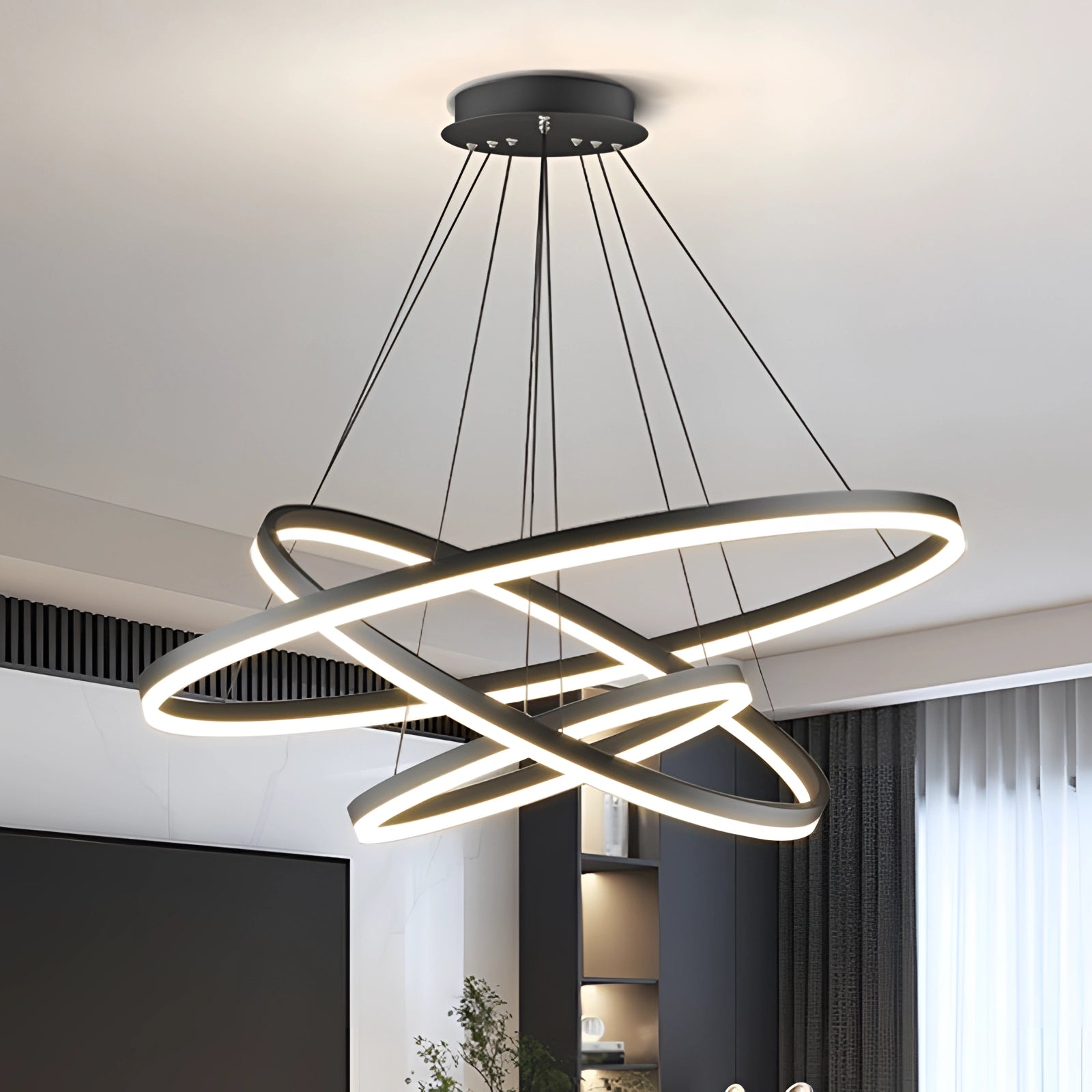 Modern LED circular chandelier with an orbit design, featuring sleek and contemporary elements, suspended from the ceiling, showcasing its artistic and ambient lighting.