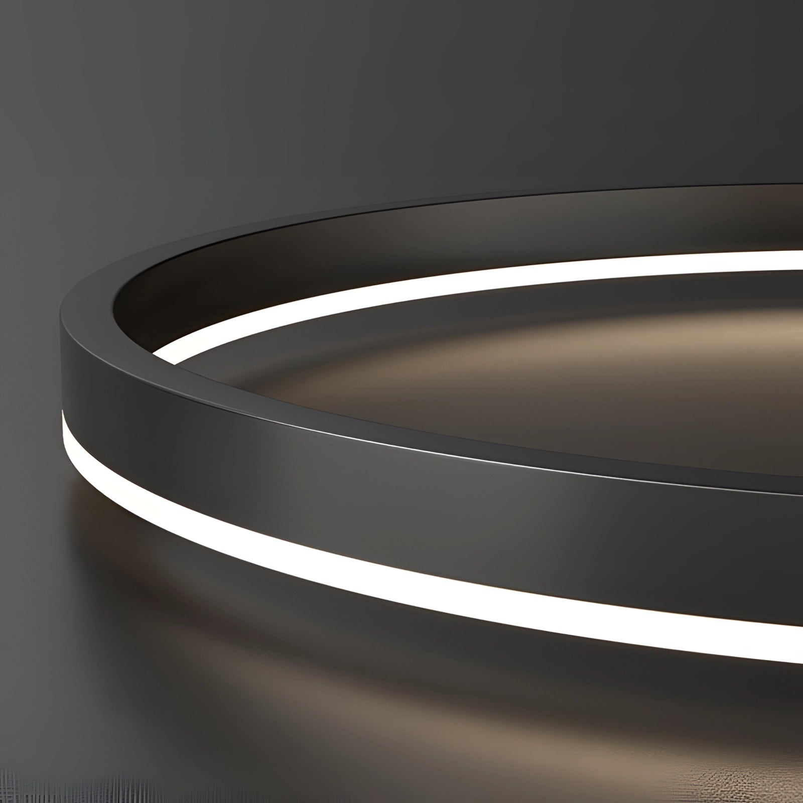 A modern LED pendant light featuring a sleek circular chandelier design with an orbit-inspired structure, highlighted by a contemporary metallic finish.