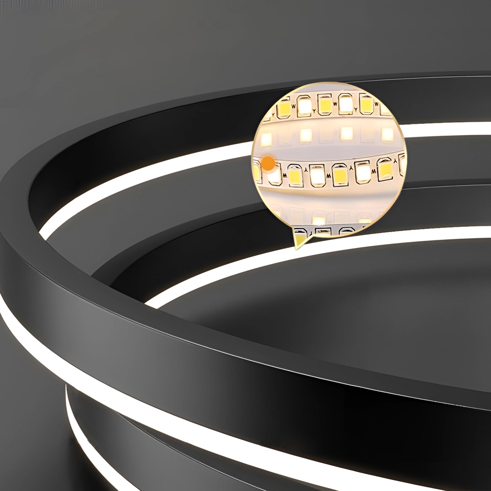 Circular chandelier with an orbit design, featuring a modern LED pendant light, suspended with sleek lines and metallic finish, suitable for contemporary home interiors.