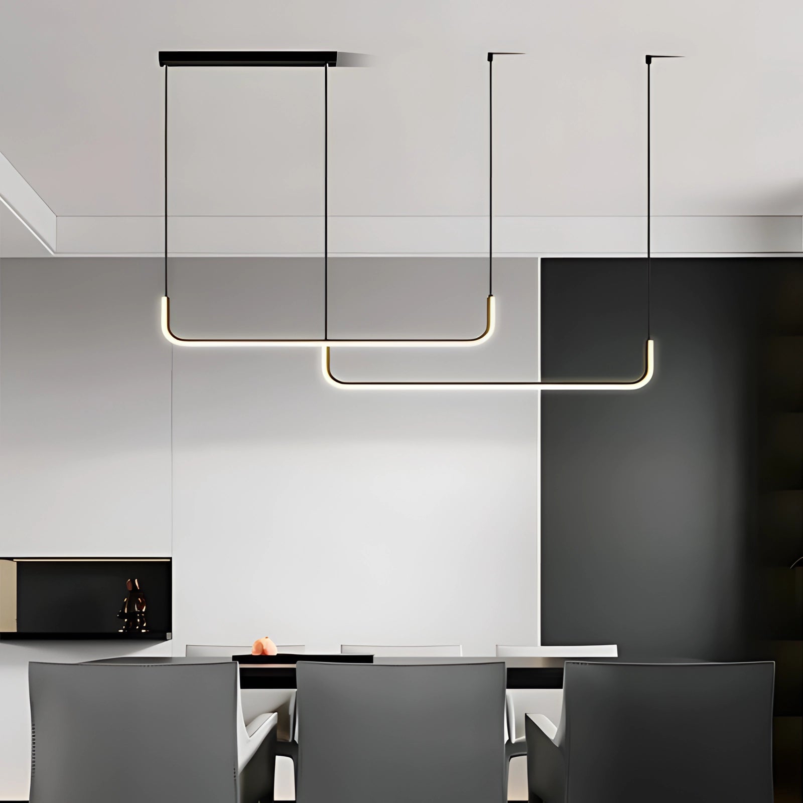 Modern LED pendant light with a geometric chandelier design, featuring a sleek black finish and adjustable hanging length of 150 cm, installed on a ceiling and illuminating a contemporary interior space.