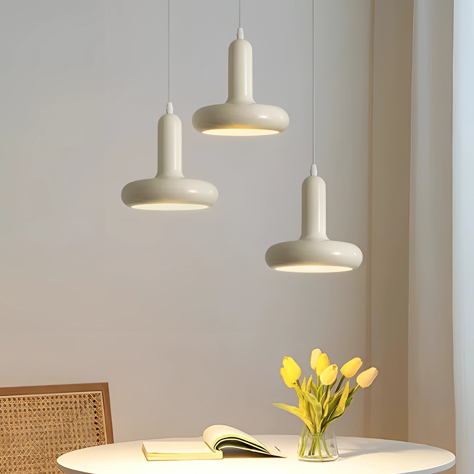Modern LED pendant light with a Scandinavian minimalist design, featuring a rectangular wooden fixture suspended from the ceiling, illuminating a kitchen or dining space. The setting includes sleek interior elements and a touch of greenery from a nearby plant.