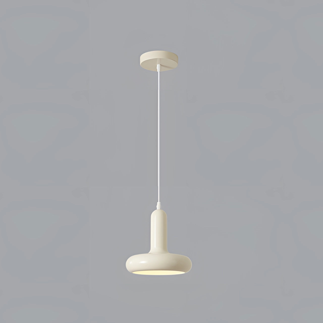 Modern LED pendant light featuring a Scandinavian minimalist design, shown as a single pendant. The light fixture is elegantly suspended from the ceiling, showcasing a circular shape and composed of composite materials. The pendant exudes a soft, energy-efficient glow, ideal for contemporary kitchen and dining settings.
