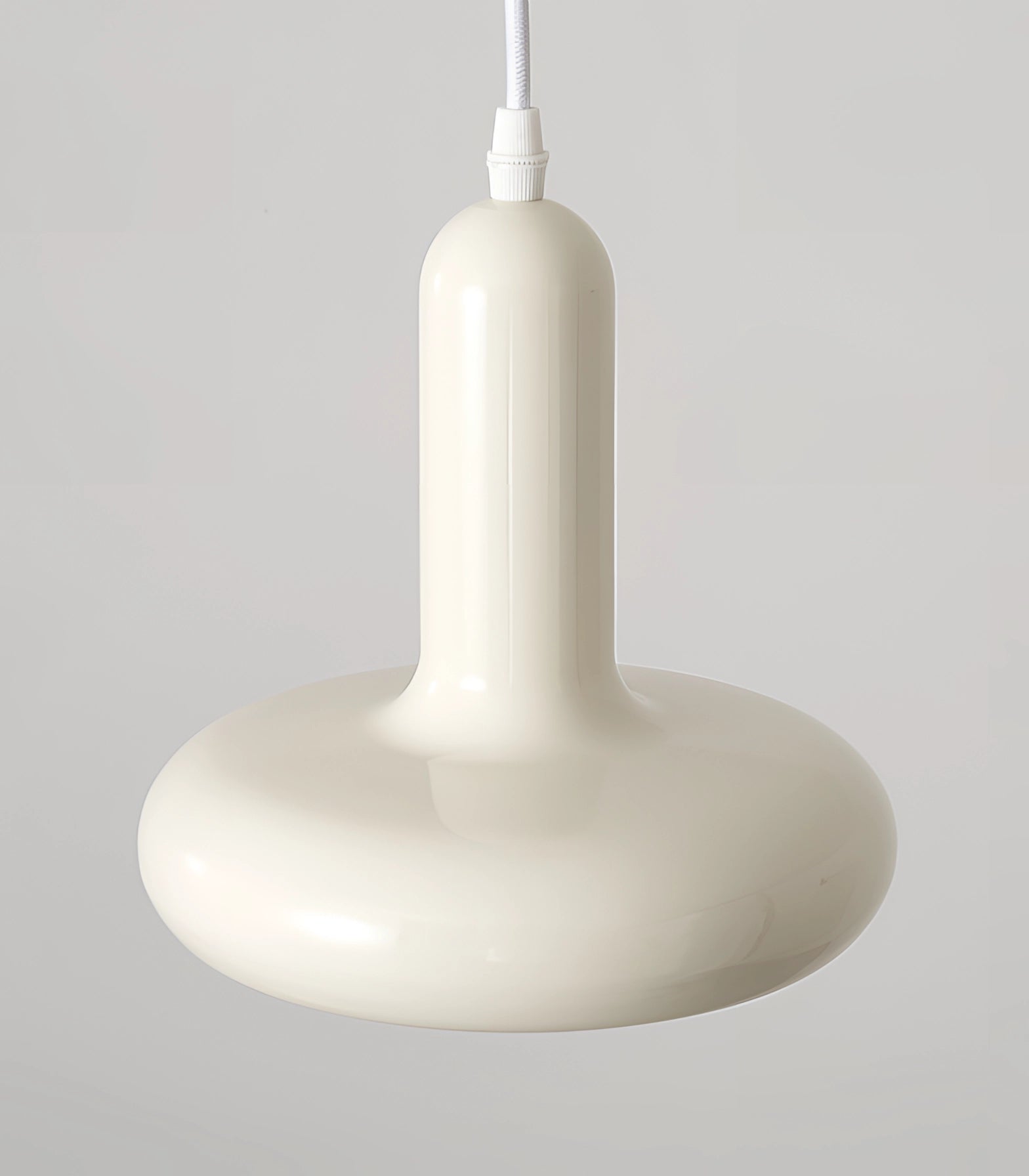 Modern LED pendant light with a Scandinavian minimalist design, featuring a metal circular shade and wood accents, hanging as a ceiling fixture in a kitchen or dining area.