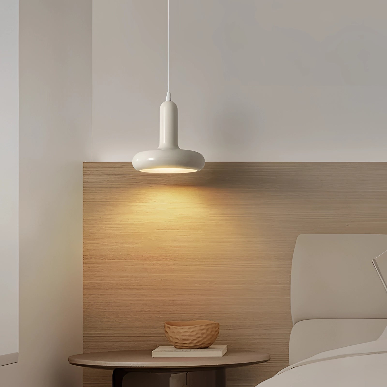 Modern LED pendant light with a Scandinavian minimalist design, featuring a wooden accent and sleek shade, illuminating a stylish kitchen and dining space with warm lighting that enhances the interior design.