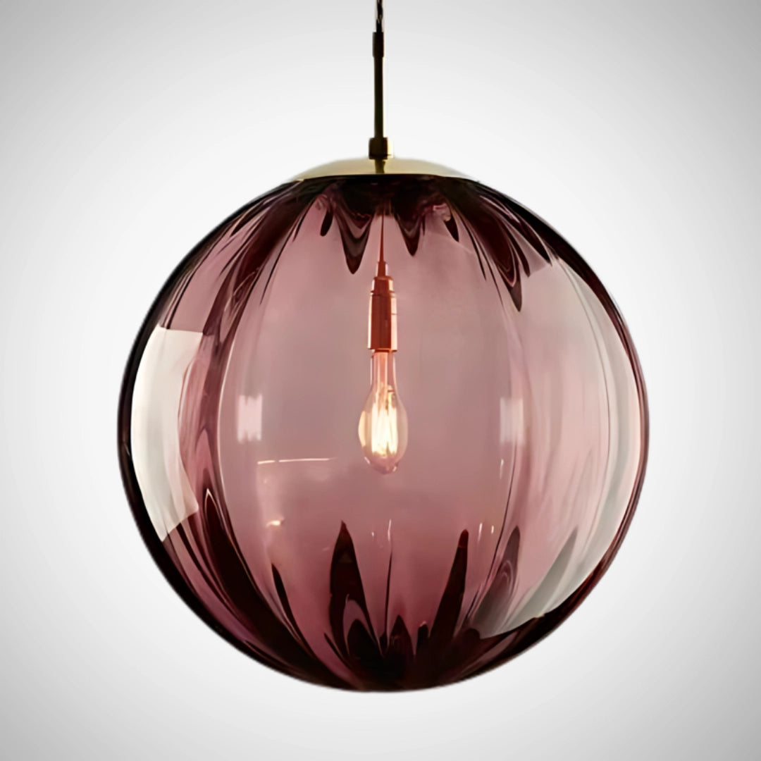 Modern LED pendant light with a red designer glass shade, measuring 20cm, hanging from a ceiling, featuring a circular shape and sleek, contemporary design.