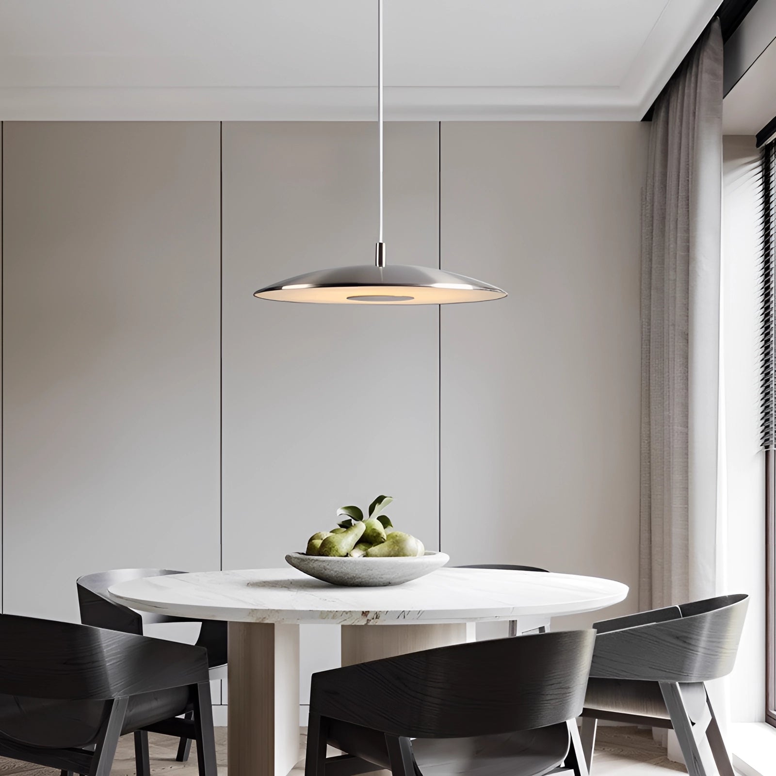 Modern LED pendant lights in stylish silver hanging above a dining table, enhancing contemporary interior design with sleek rectangular shapes and wooden accents.