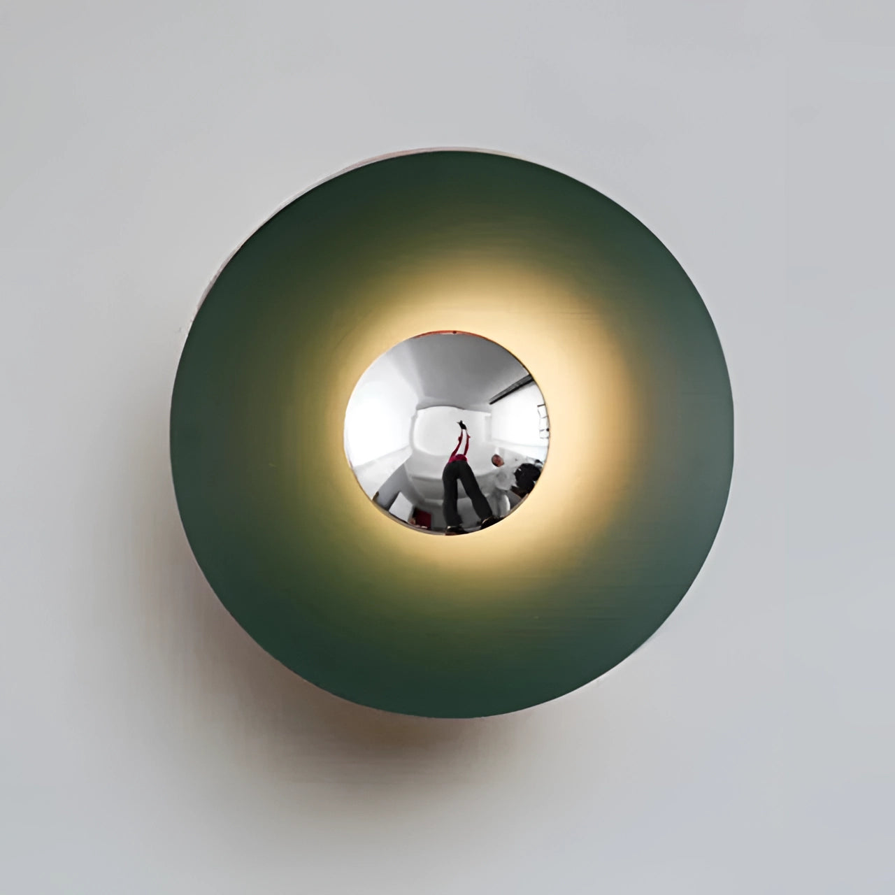 Modern LED wall lamp with a minimalistic brass decorative sconce, featuring a sleek green and silver design. The lamp measures 60cm and emits a cold white light. Its circular shape resembles a ceiling fixture, adding an artistic touch to the space.