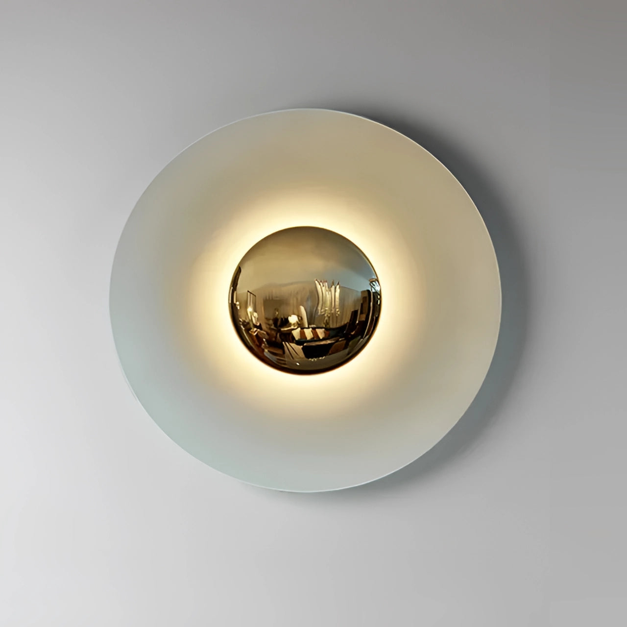 Modern LED wall lamp with a minimalistic design, featuring a white and gold color scheme. The decorative brass sconce measures 60cm and emits a cold white light, suitable for contemporary interior design. The fixture, which includes circular and spherical elements, is a stylish lighting accessory perfect for walls.