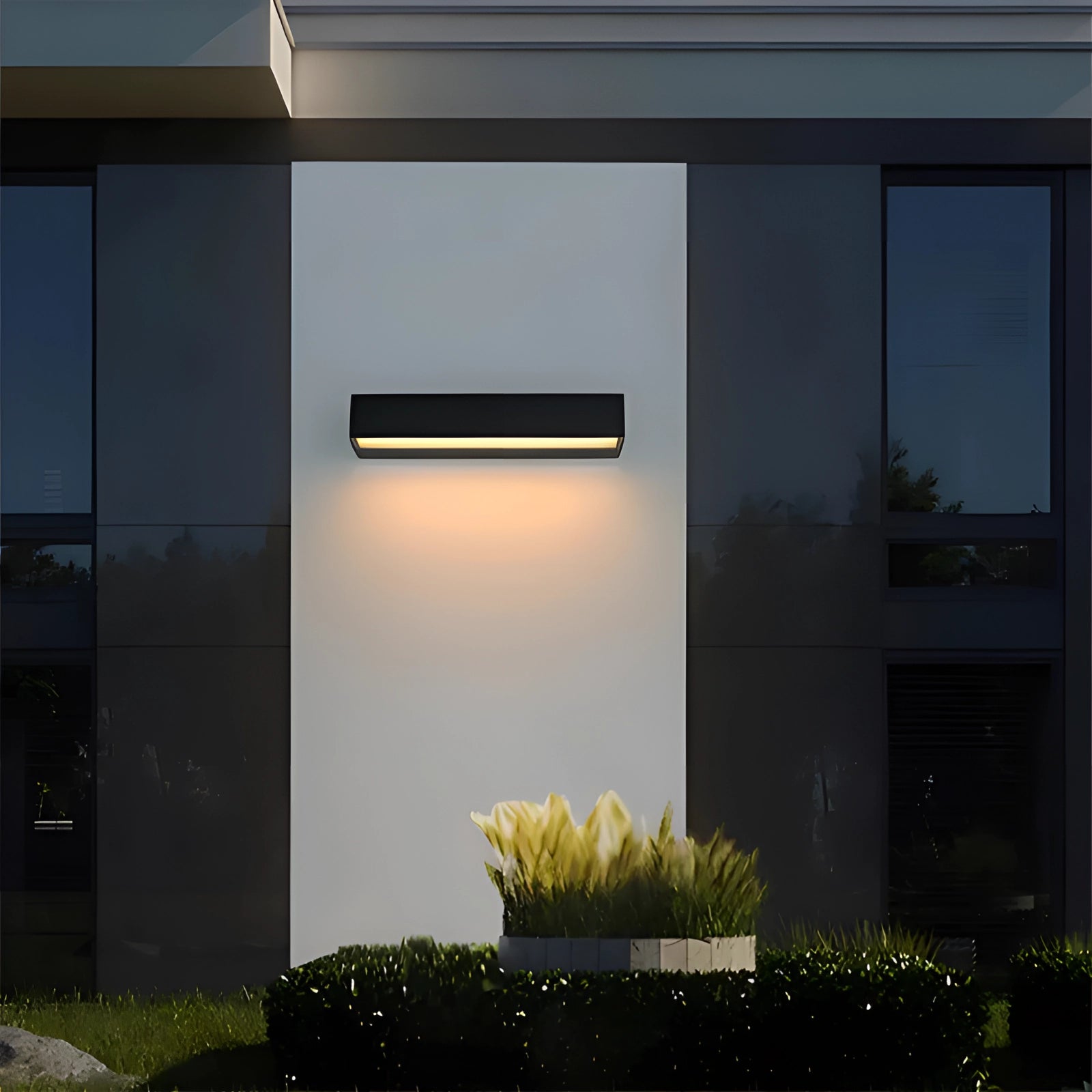 Modern LED wall light in sleek black with a minimalistic design mounted on a wall near a window, featuring a rectangular shape and contemporary urban design elements.