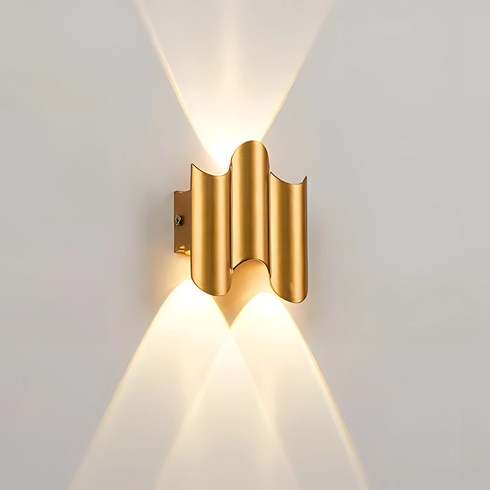 A modern LED wall sconce with a black geometric design featuring indirect lighting, accentuated with gold elements. The fixture has a sleek, minimalist appearance, suitable for a contemporary interior setting, and provides 7 watts of illumination.