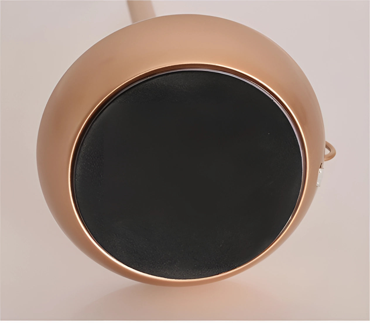 Modern luxury metallic candle holders with elegant design, perfect for home decor, displayed on a wooden surface.
