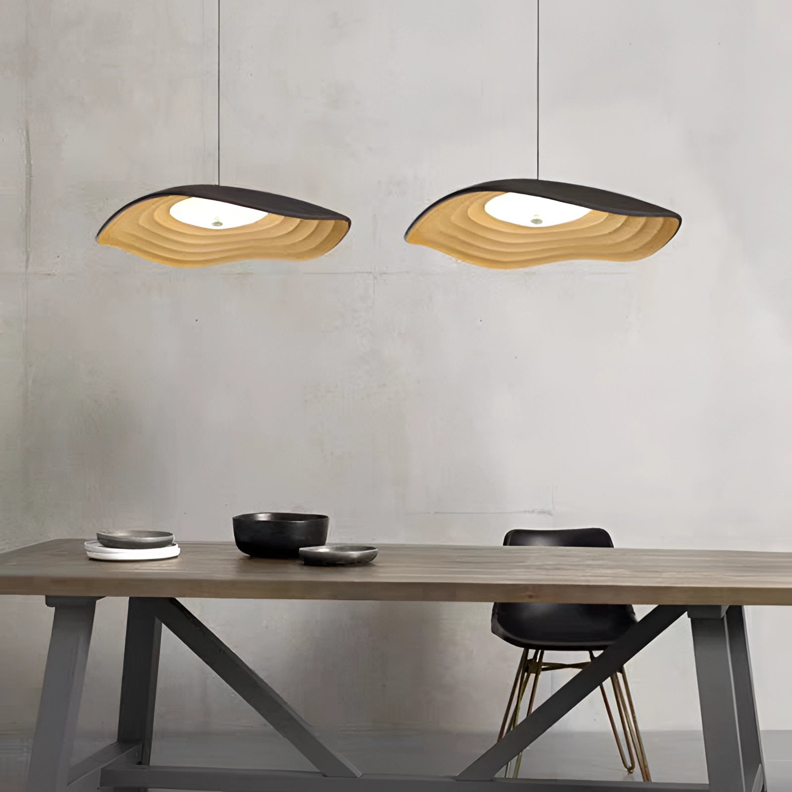 Modern luxury pendant light with LED illumination featuring elegant wooden accents, hanging over a table in a stylish interior setting.