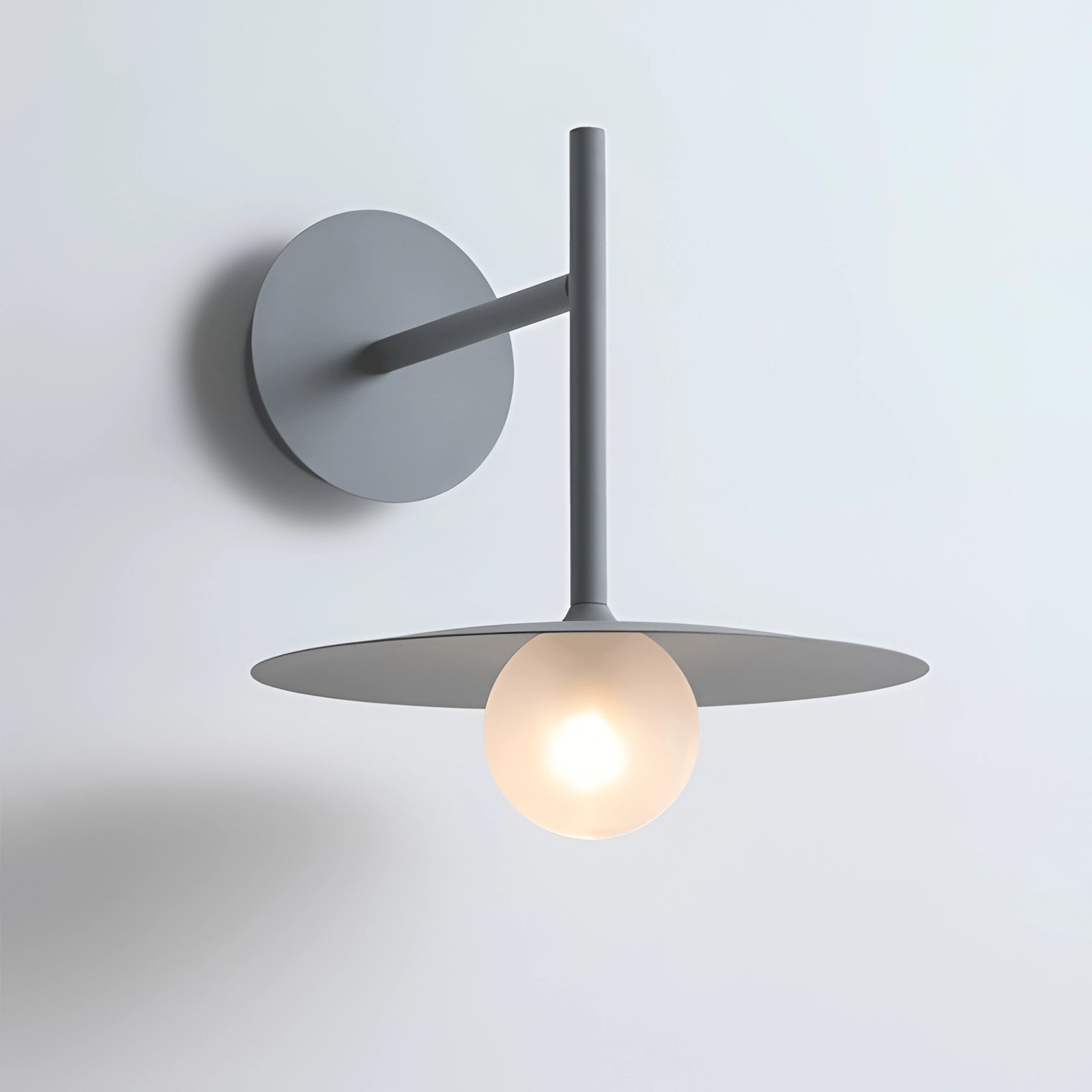 Modern matte black minimalist wall sconce with a grey finish, mounted on a wall, featuring a metal and wood design, suitable for bedrooms and hallways.