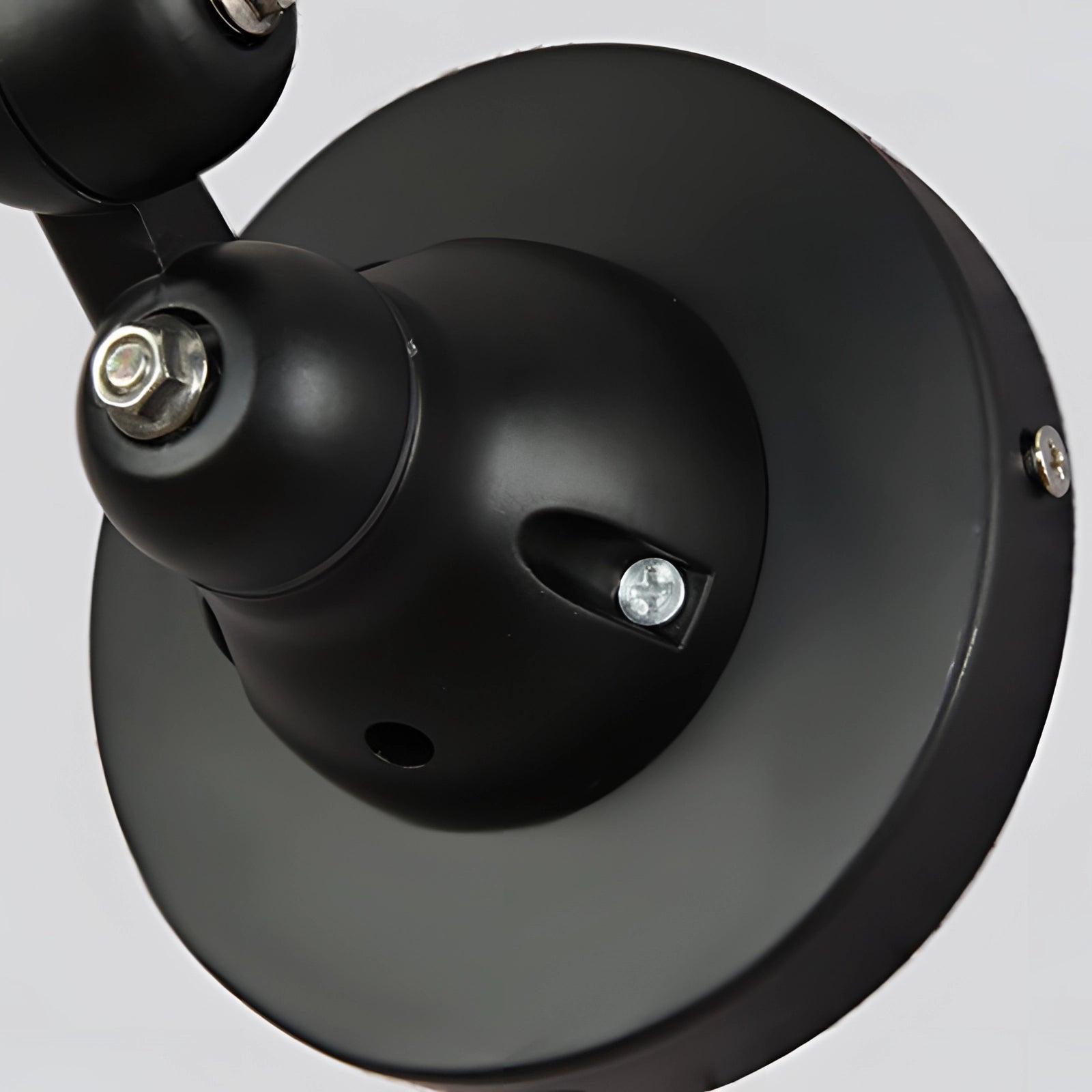 Modern matte black swing arm wall lamp with adjustable arm, industrial design, suitable for home or office interior lighting. 
