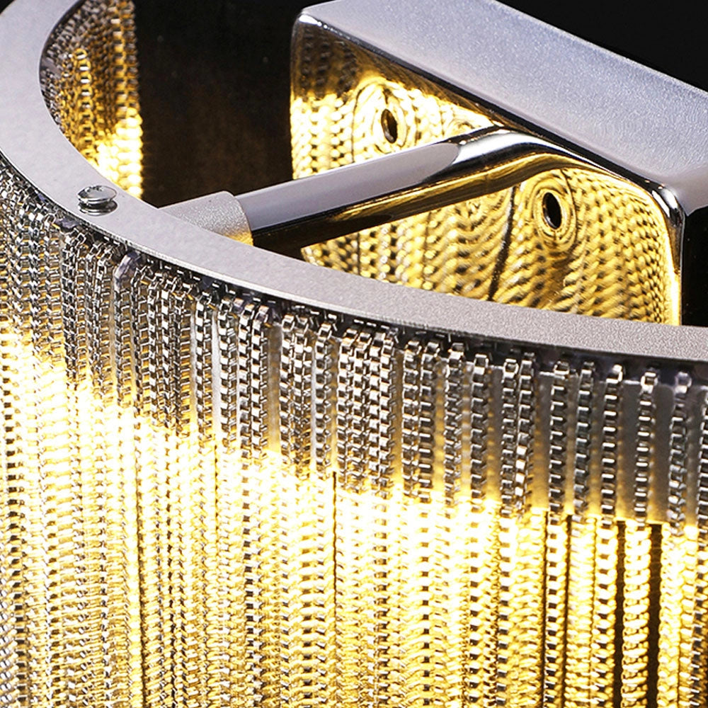 Modern metallic fringe chandelier with a luxurious contemporary design, featuring a gold and amber color scheme. The chandelier is rectangular in shape with mesh-like details, creating a symmetrical and elegant appearance suitable for upscale interiors.