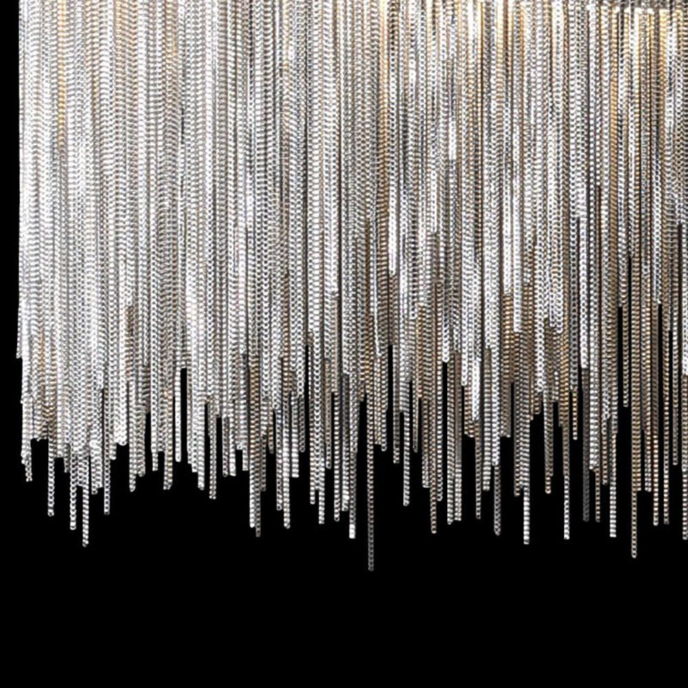 Modern metallic fringe chandelier with a luxury contemporary design, featuring intricate patterns and symmetrical detailing, adding an artistic touch to any space.