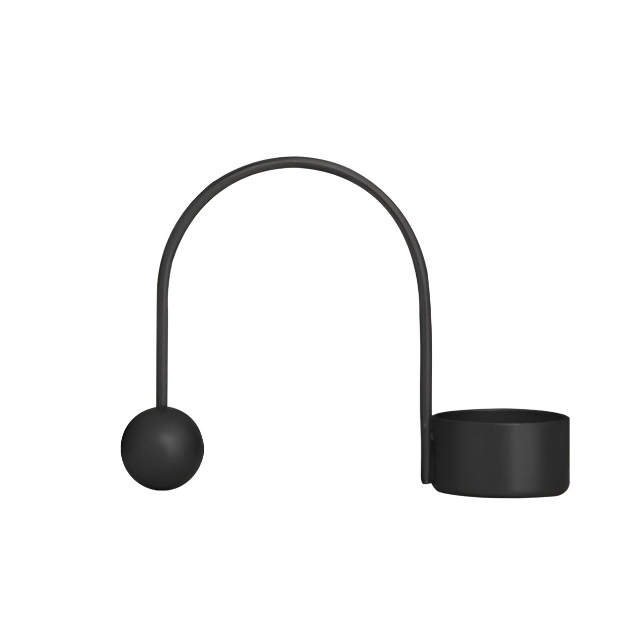 Modern minimalist black brass candlestick holder with a unique designer style, featuring a sleek and understated design suitable for 0.75 inch candles.