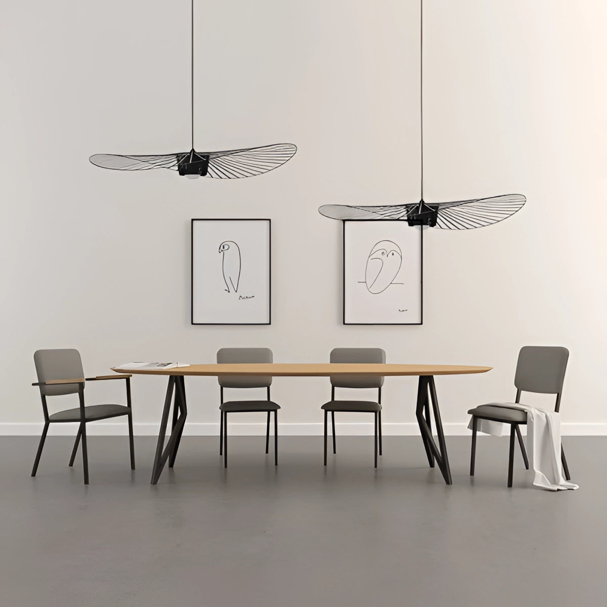Modern minimalist ceiling fan with a sleek wing-shaped design installed on a ceiling, blending seamlessly with a contemporary interior.
