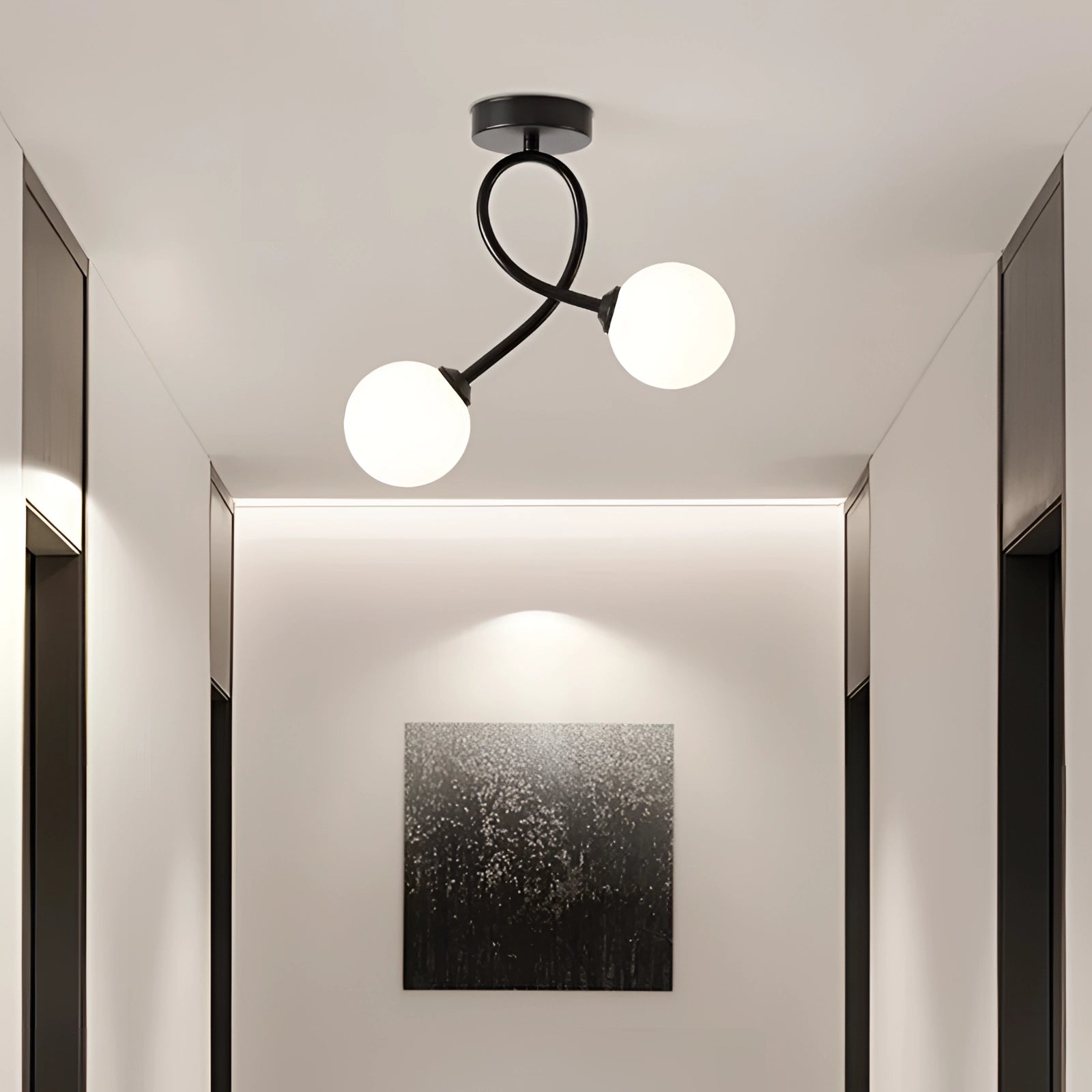 Modern minimalist ceiling light fixture with double globe design in black and white, featuring glass shades, mounted on a ceiling in a contemporary interior setting.