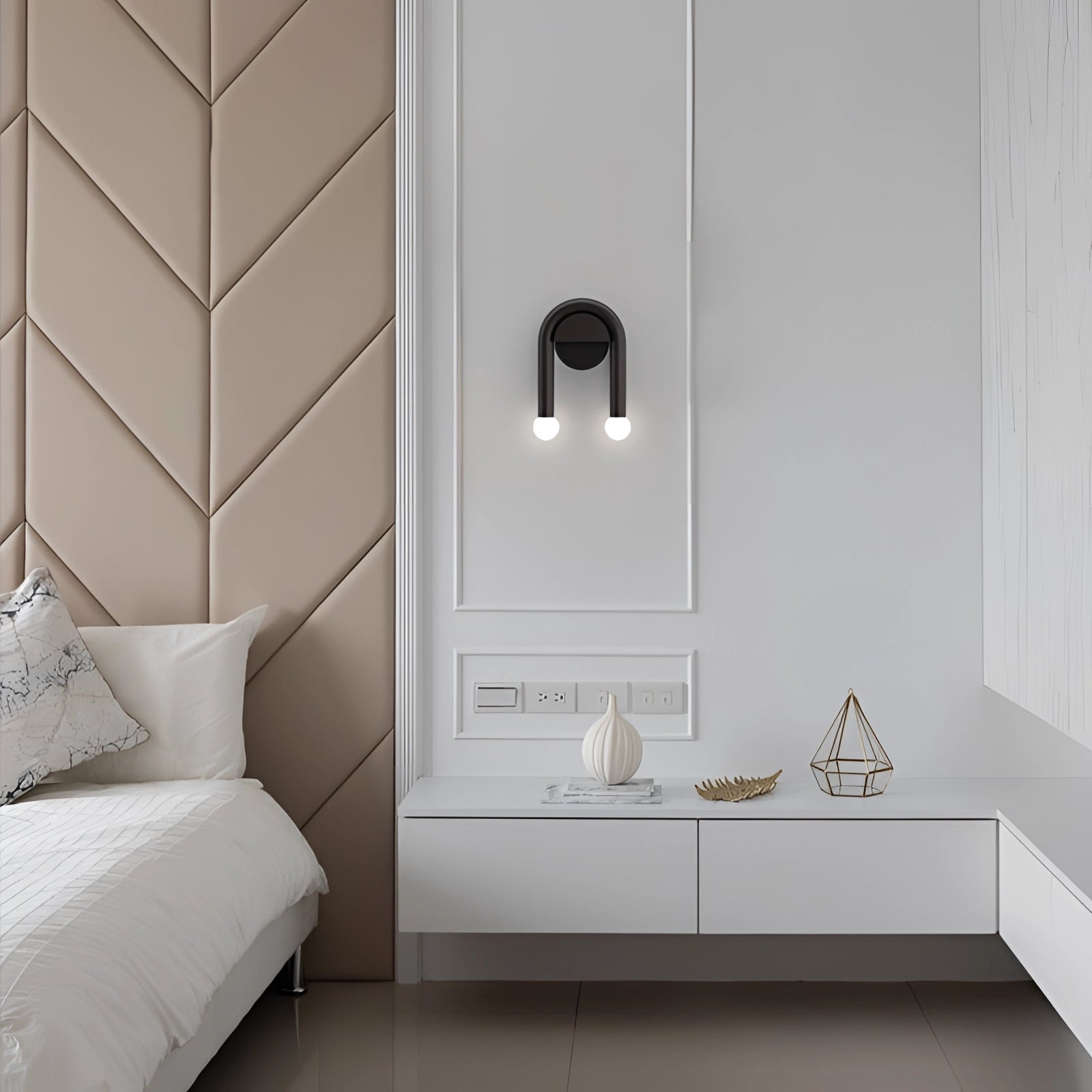 Modern minimalist black matte LED dual wall lamp mounted on a grey wall with wooden cabinetry and shelving in the background.