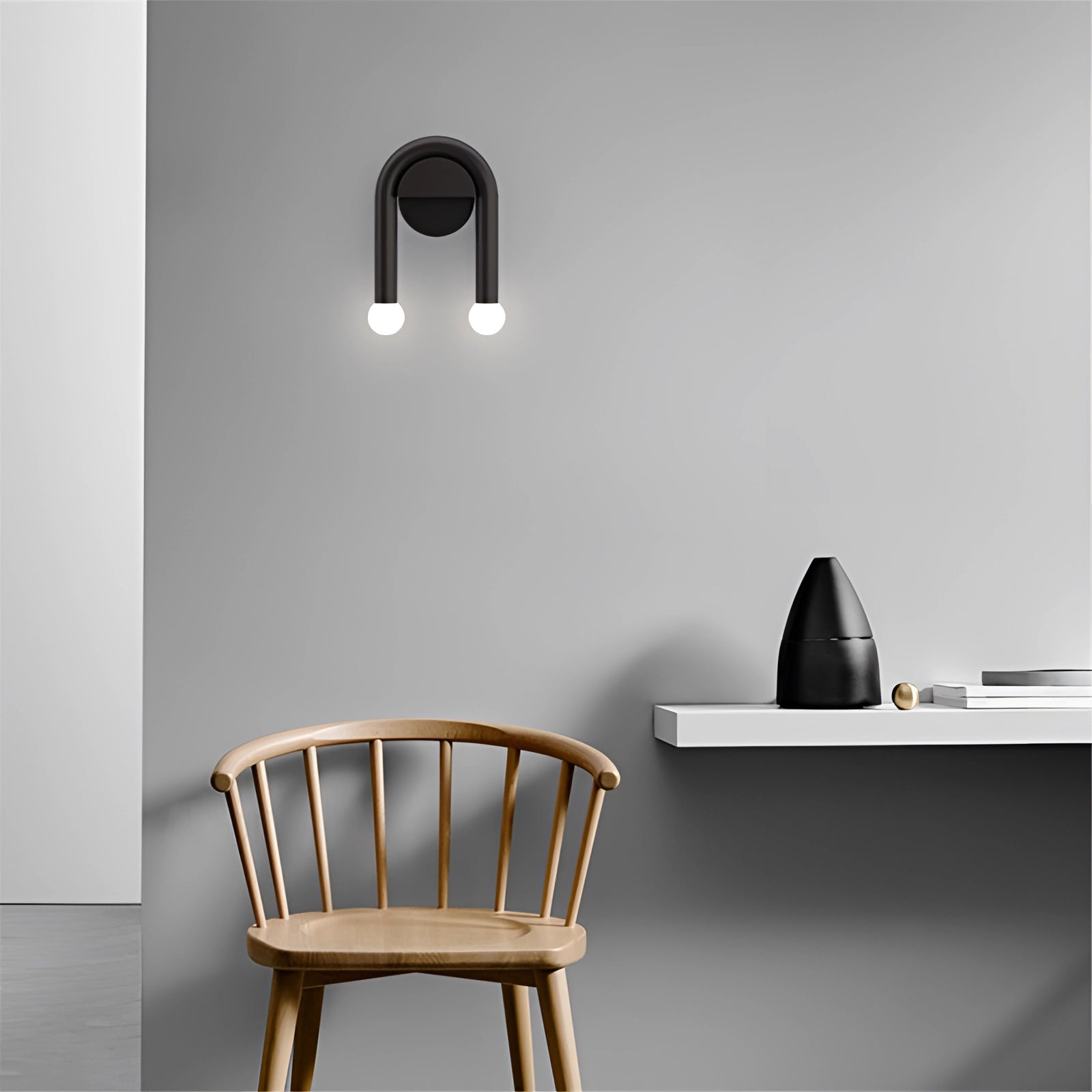 Modern Minimalist LED Dual Wall Lamp in Black Matte finish, mounted on a grey wall with minimalistic wooden shelving and a comfortable chair nearby.