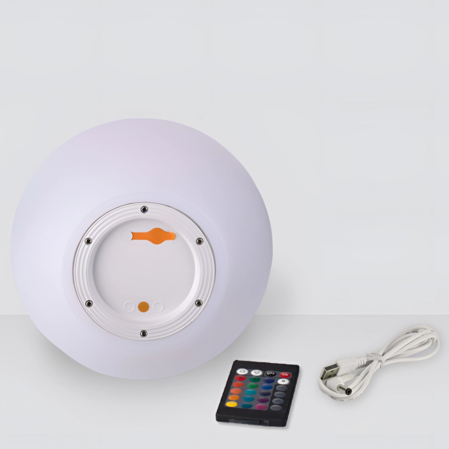 Modern Minimalist LED Globe Lamp, spherical rechargeable cordless bedside light, illuminated, positioned on a flat surface.