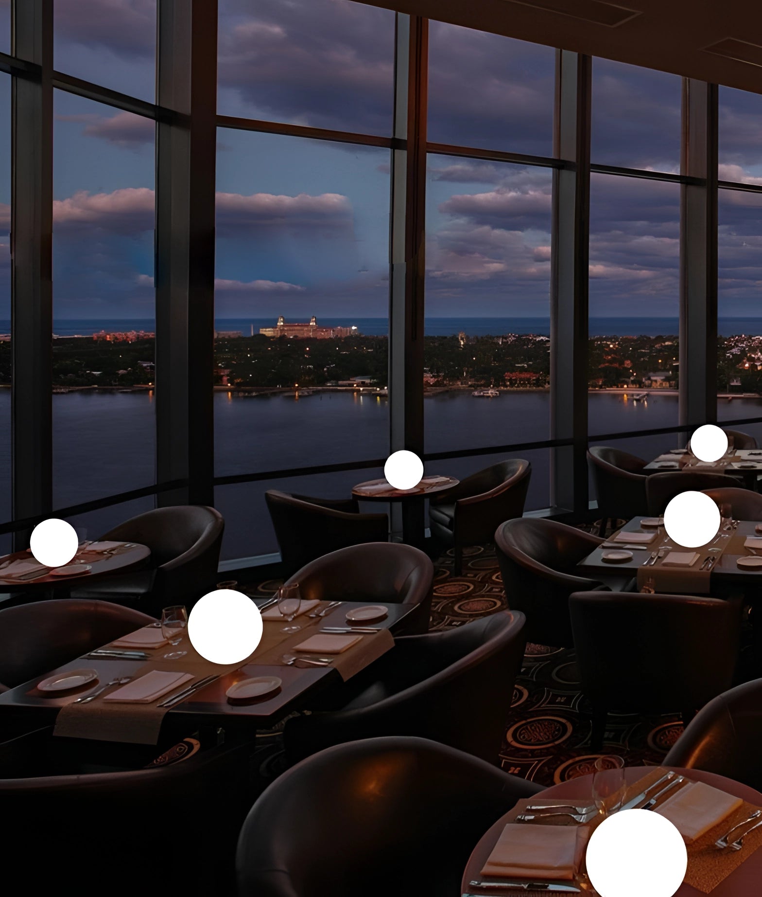 Modern Minimalist LED Globe Lamp on a bedside table near a window with a view of buildings and sky, showcasing interior design elements and furniture.