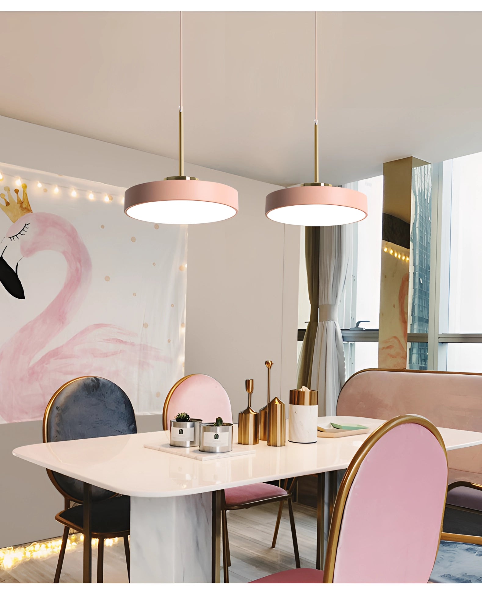 Modern minimalist LED pendant lights in gold and white, hanging above a wooden table and chairs in a well-lit living room with hardwood flooring.