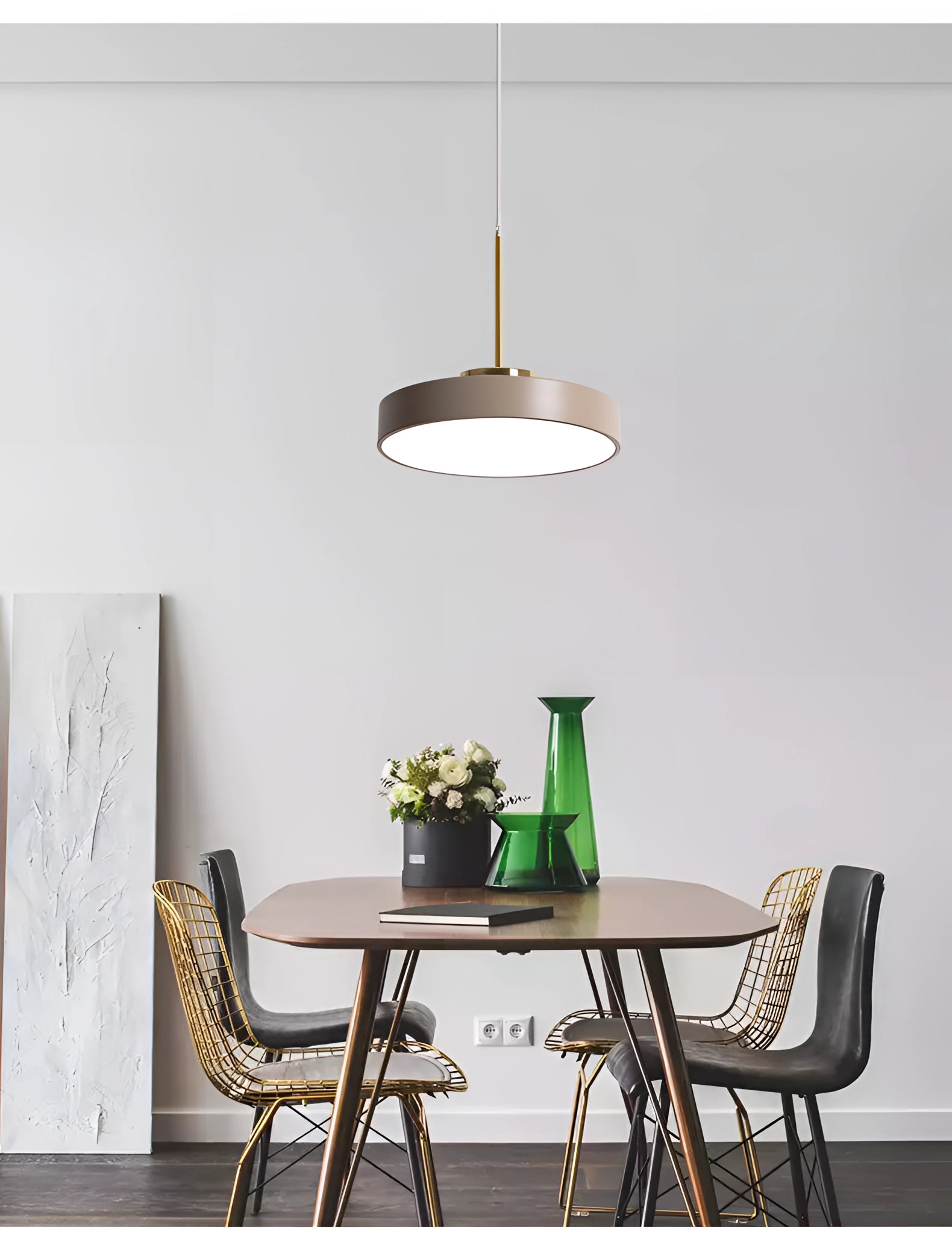 Modern Minimalist LED Pendant Lights in Gold & White illuminating a stylish interior with contemporary furniture including a table, chairs, and a plant.