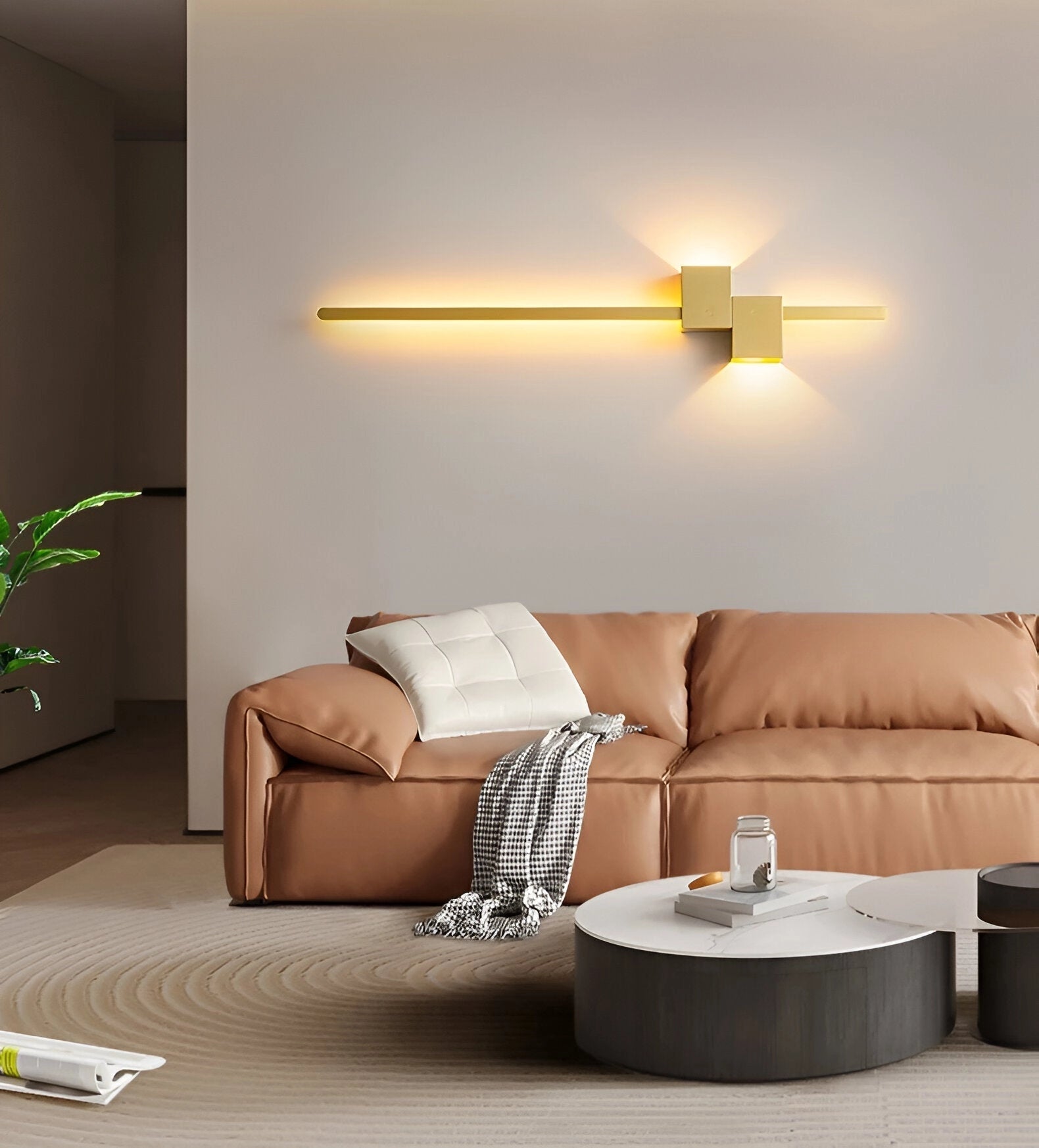 Modern minimalist LED wall light in gold with a sleek 92cm rectangular design, mounted on a wall showcasing contemporary interior design elements with wooden flooring in a comfortable and stylish bedroom setting.