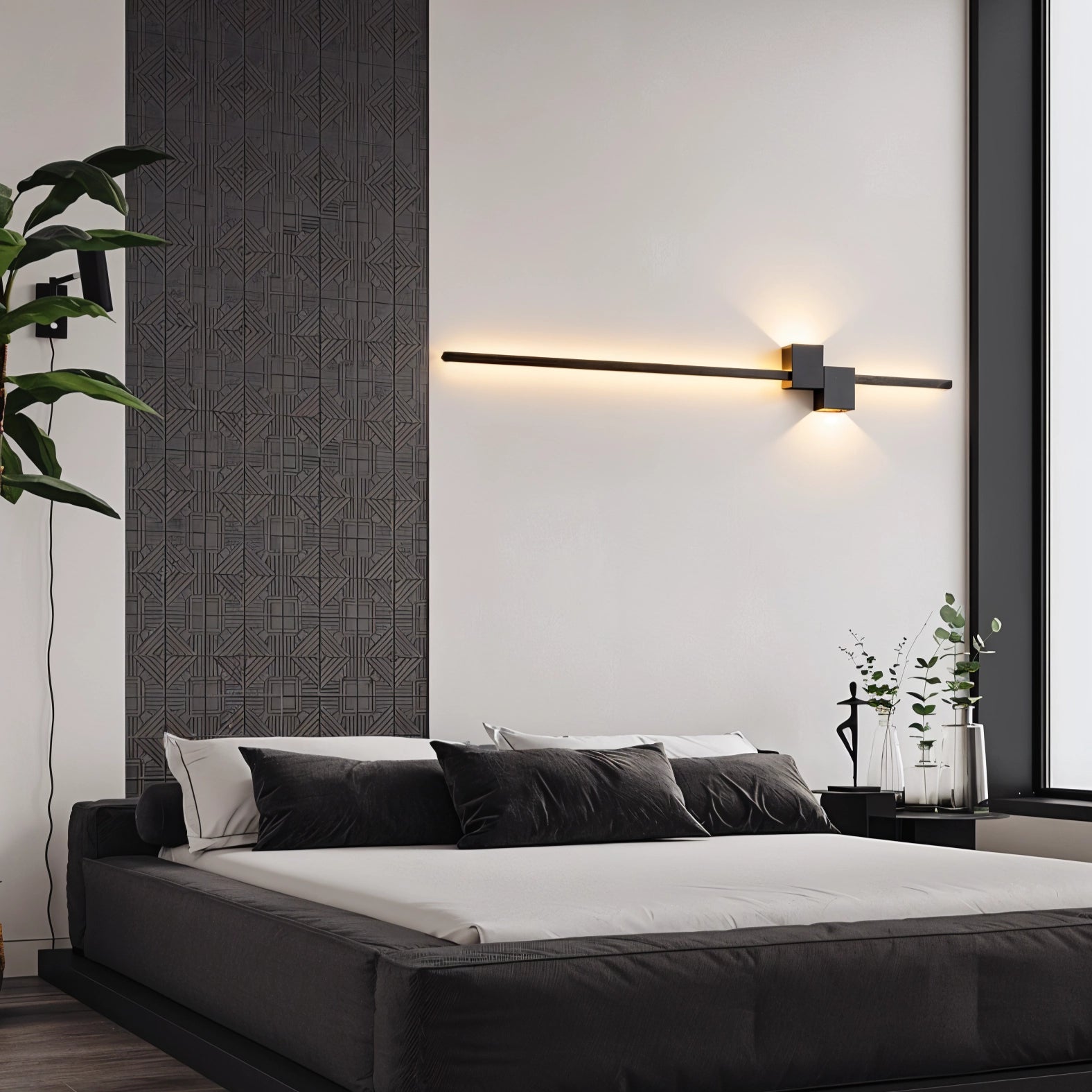 Modern minimalist LED wall light with a rectangular black shade, mounted on a wooden base, illuminating a contemporary bedroom setting with additional decor elements like a small plant in the background.