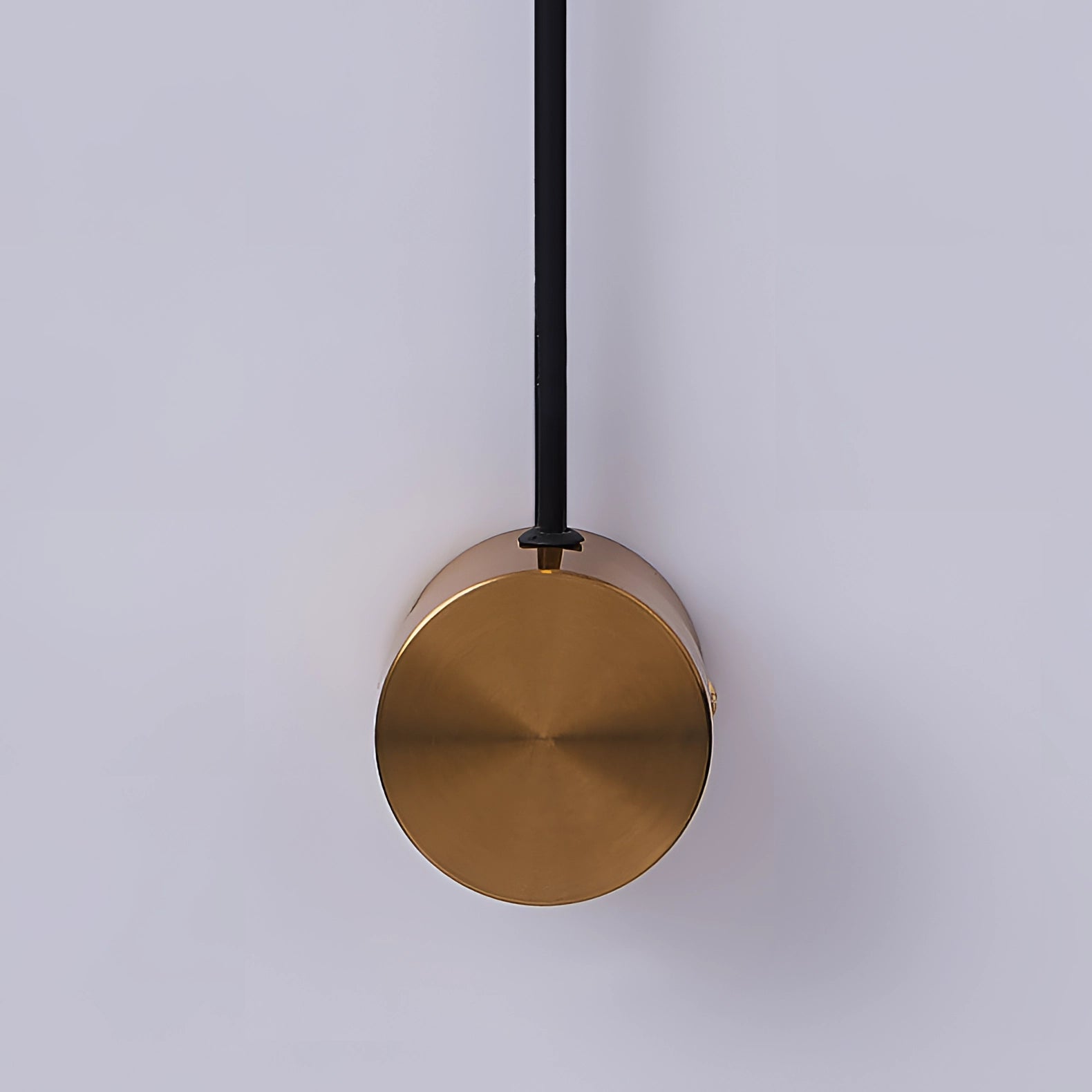 Modern minimalist LED wall sconce featuring a circular design with wood and metal elements, showcasing an adjustable light fixture ideal for bedroom decor.