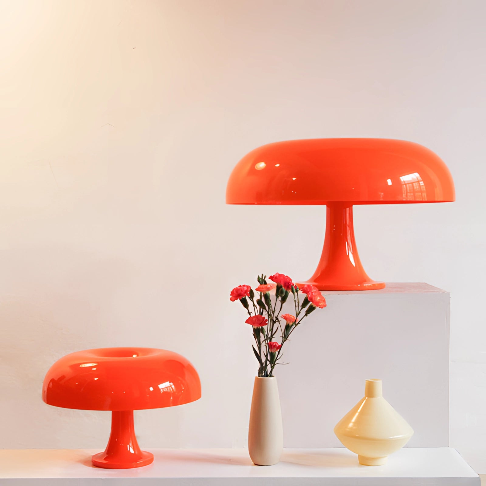 Modern minimalist mushroom-shaped LED table lamp with a sleek red design, placed on a contemporary wooden table in a stylish home office setting.