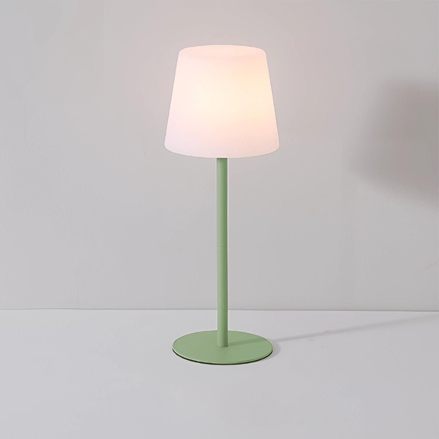Modern minimalist pastel table lamp with a rectangular lampshade sitting on a wooden base, designed for chic living room or bedroom decor.