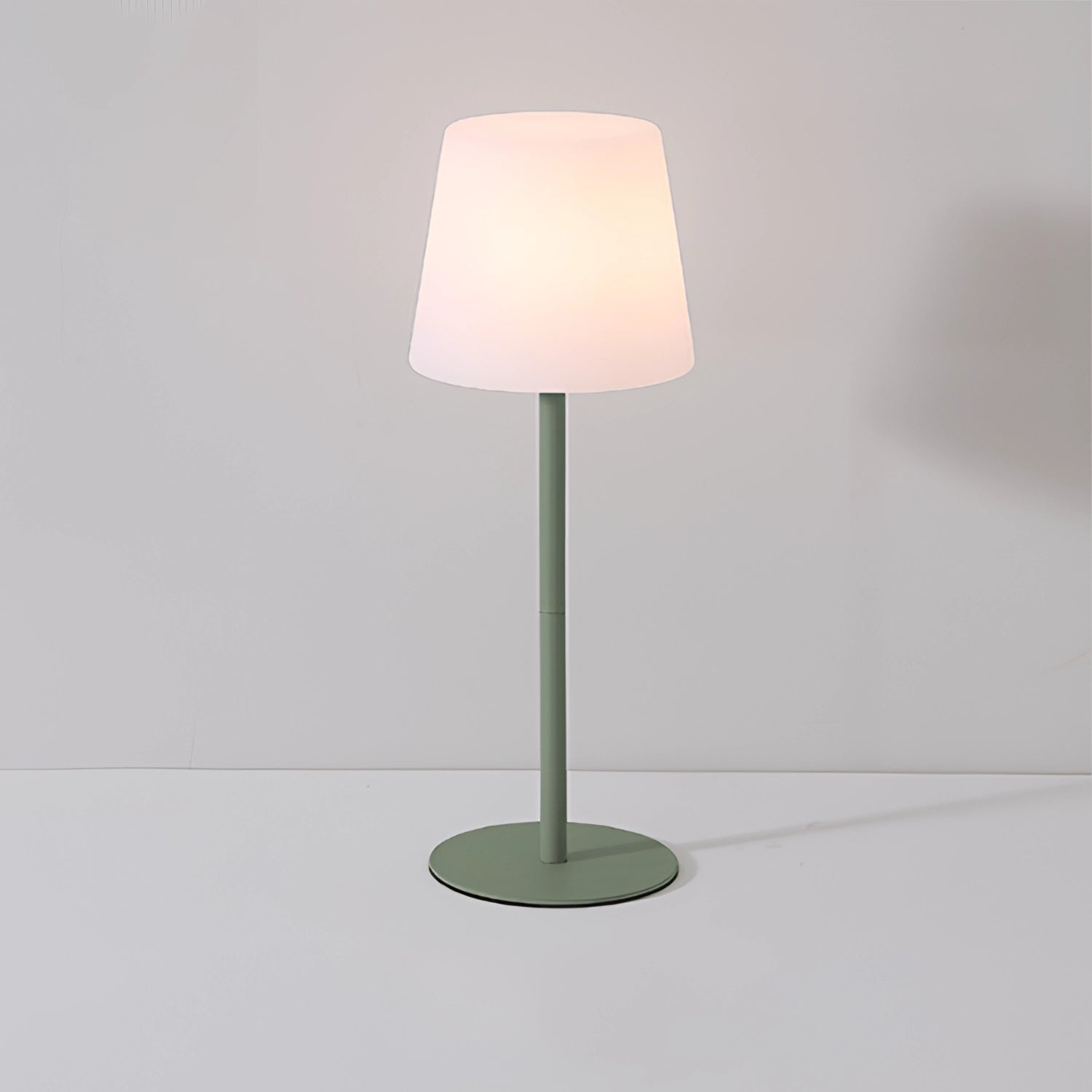 Modern minimalist pastel table lamp with a rectangular wooden base and a soft-toned lampshade, designed for chic living room and bedroom decor.