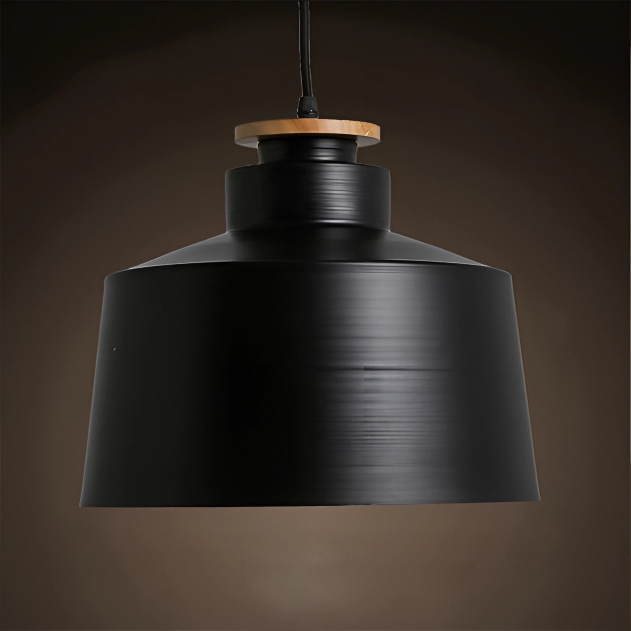 Modern minimalist black dome pendant light with black finish, Scandinavian design, hanging from ceiling.