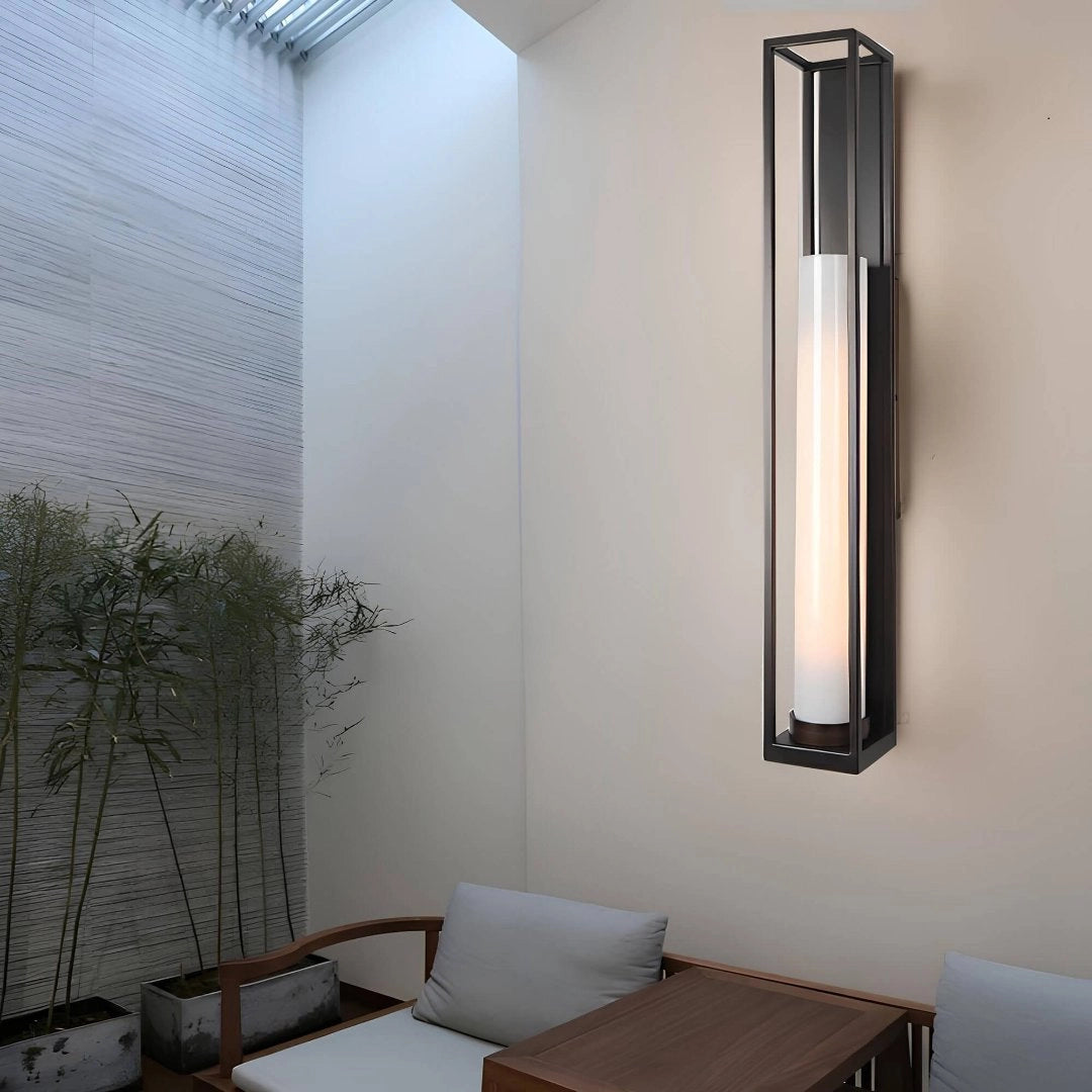 Modern minimalist wall-mounted LED light fixture illuminating a contemporary interior setting, highlighting its sleek design.