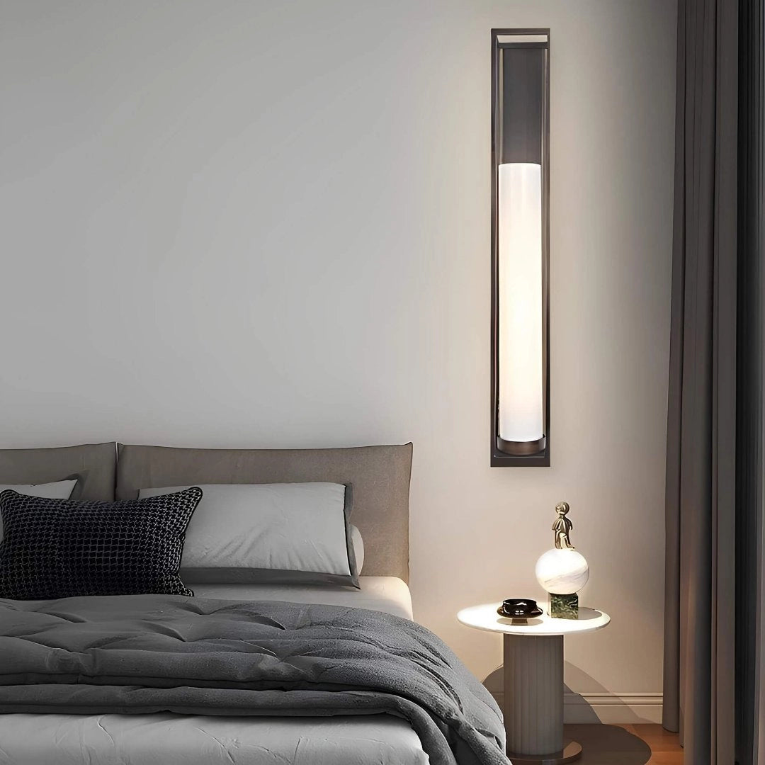 Modern minimalist wall-mounted LED light fixture with a sleek wooden shade, designed for energy efficiency, providing comfortable lighting for interior spaces.