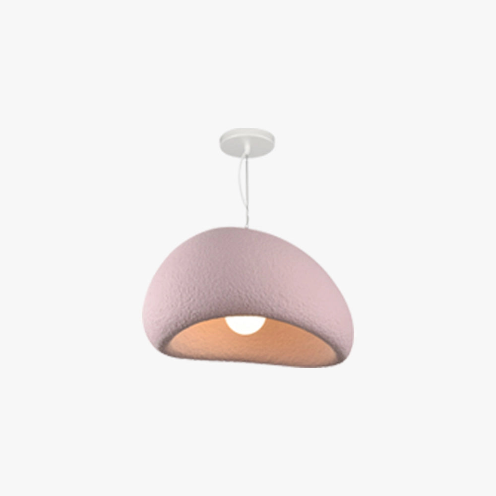 Modern minimalist white dome pendant light with a sleek and elegant design, featuring a smooth metal surface and circular shape, hanging above a wooden table in a stylish interior setting.