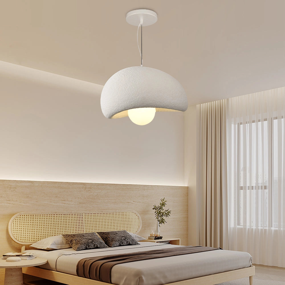 Modern minimalist white dome pendant light hanging in an elegantly decorated interior, featuring a 31.5-inch white shade and surrounded by contemporary furniture and decor elements.