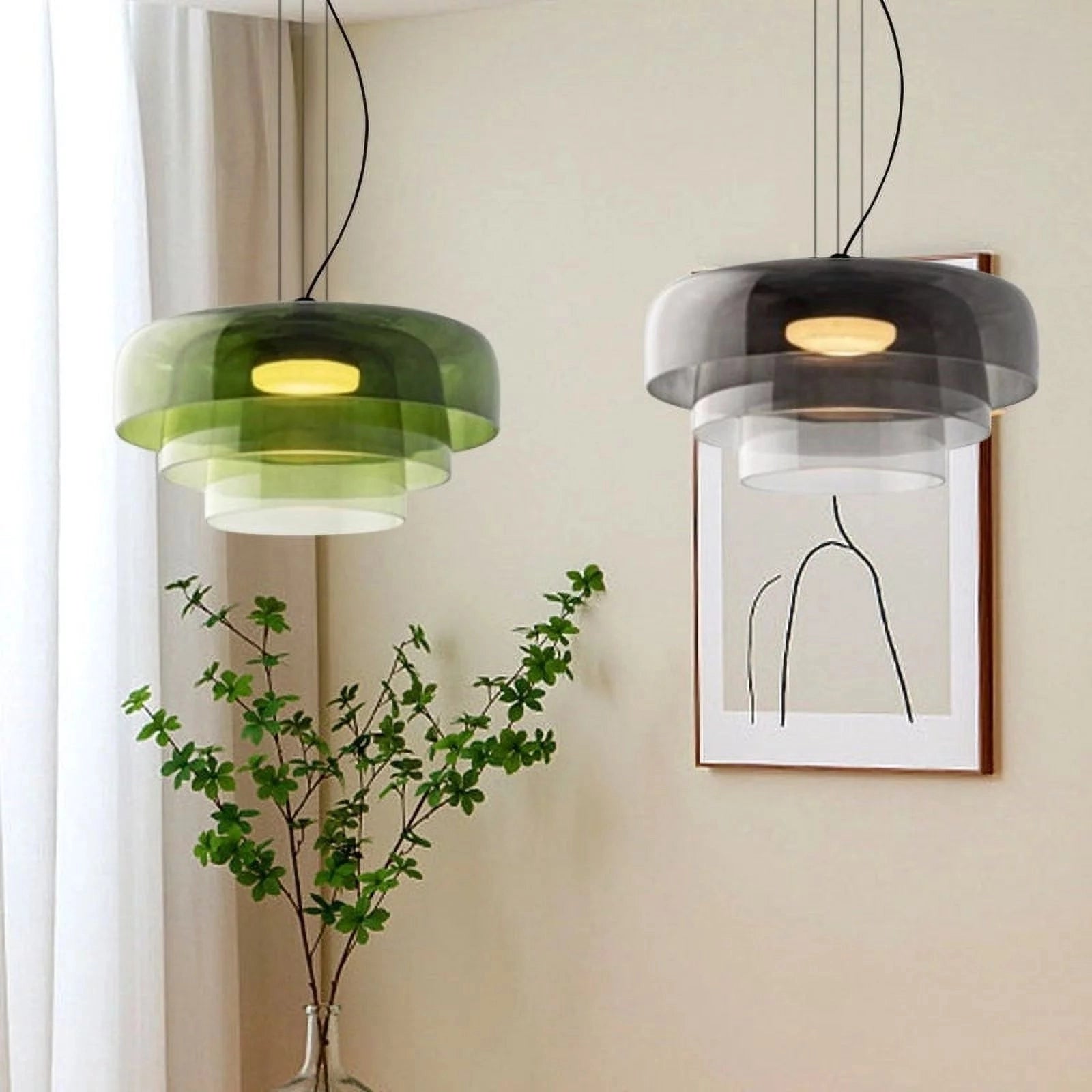 Modern multi-colored glass pendant light hanging in a contemporary setting with a green houseplant and wooden elements in the background.