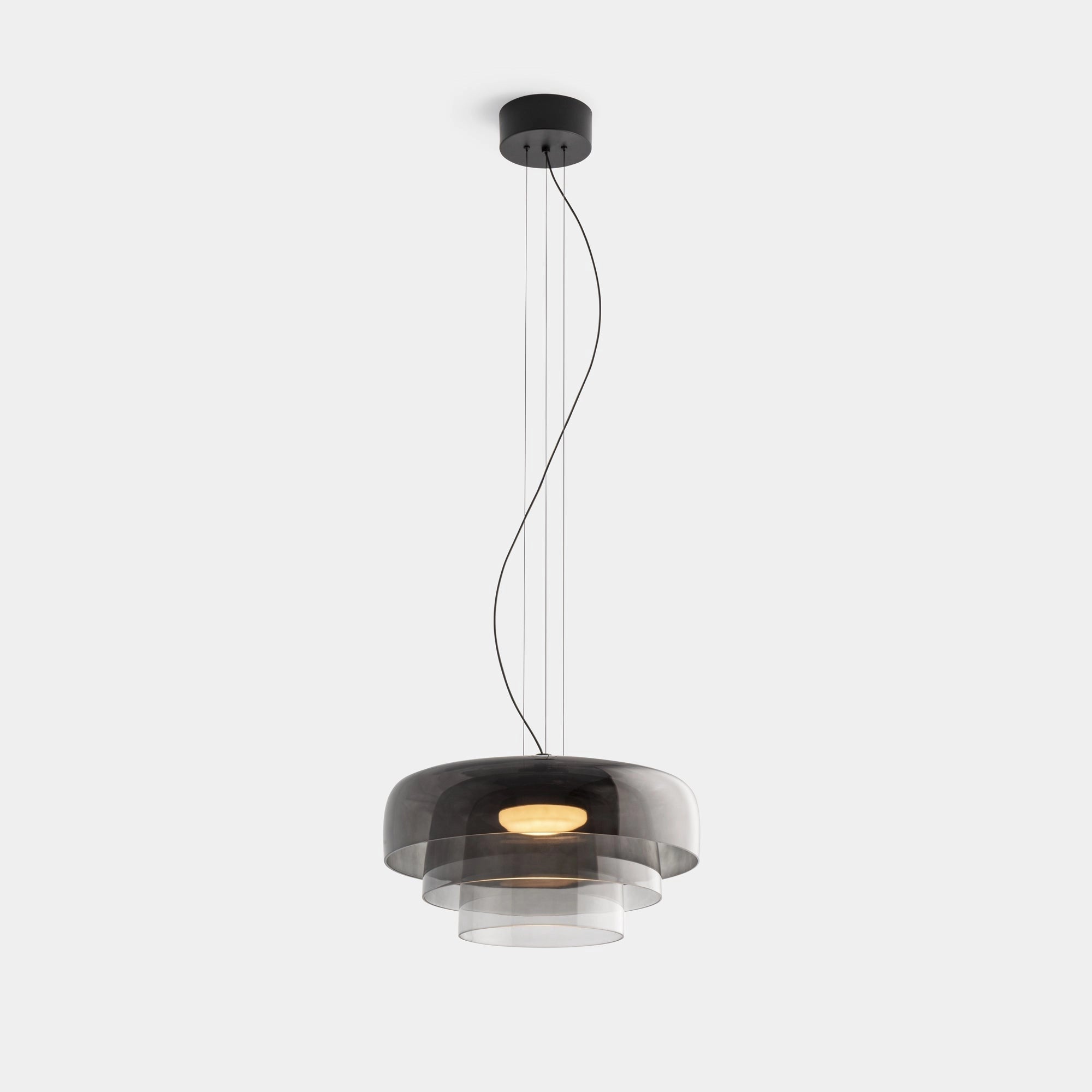 Modern multi-colored glass pendant light hanging from the ceiling, featuring a contemporary design with vibrant colors and sleek finish.