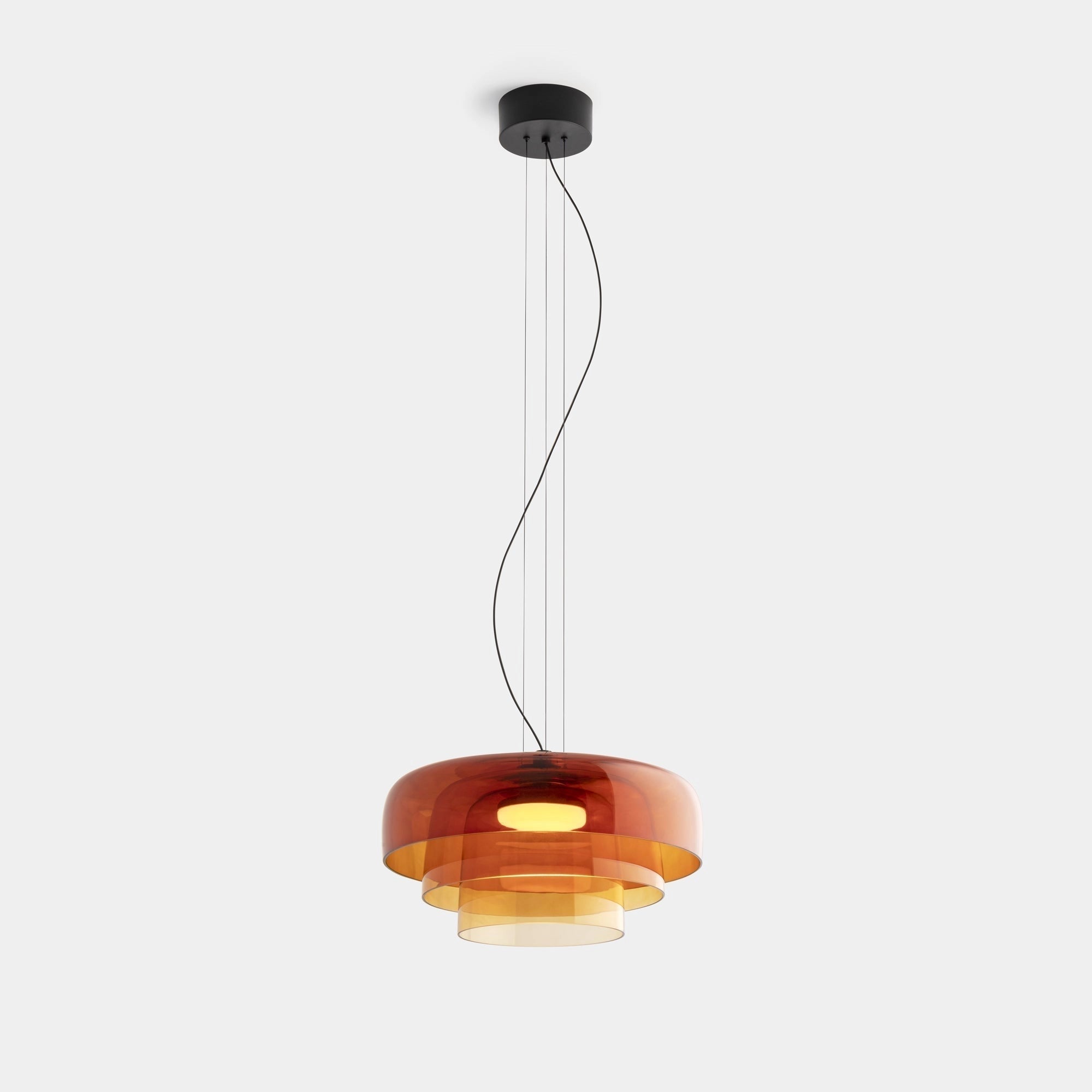 Modern multi-colored glass pendant light with a contemporary design, featuring a rectangular glass shade and metal accents, hanging from a ceiling fixture.