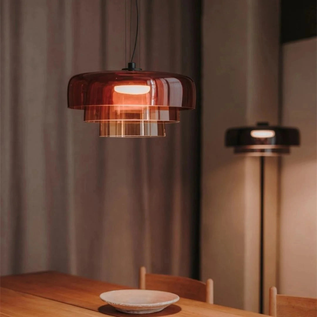 Modern multi-colored glass pendant light with contemporary design, featuring wooden accents and vibrant tints and shades.