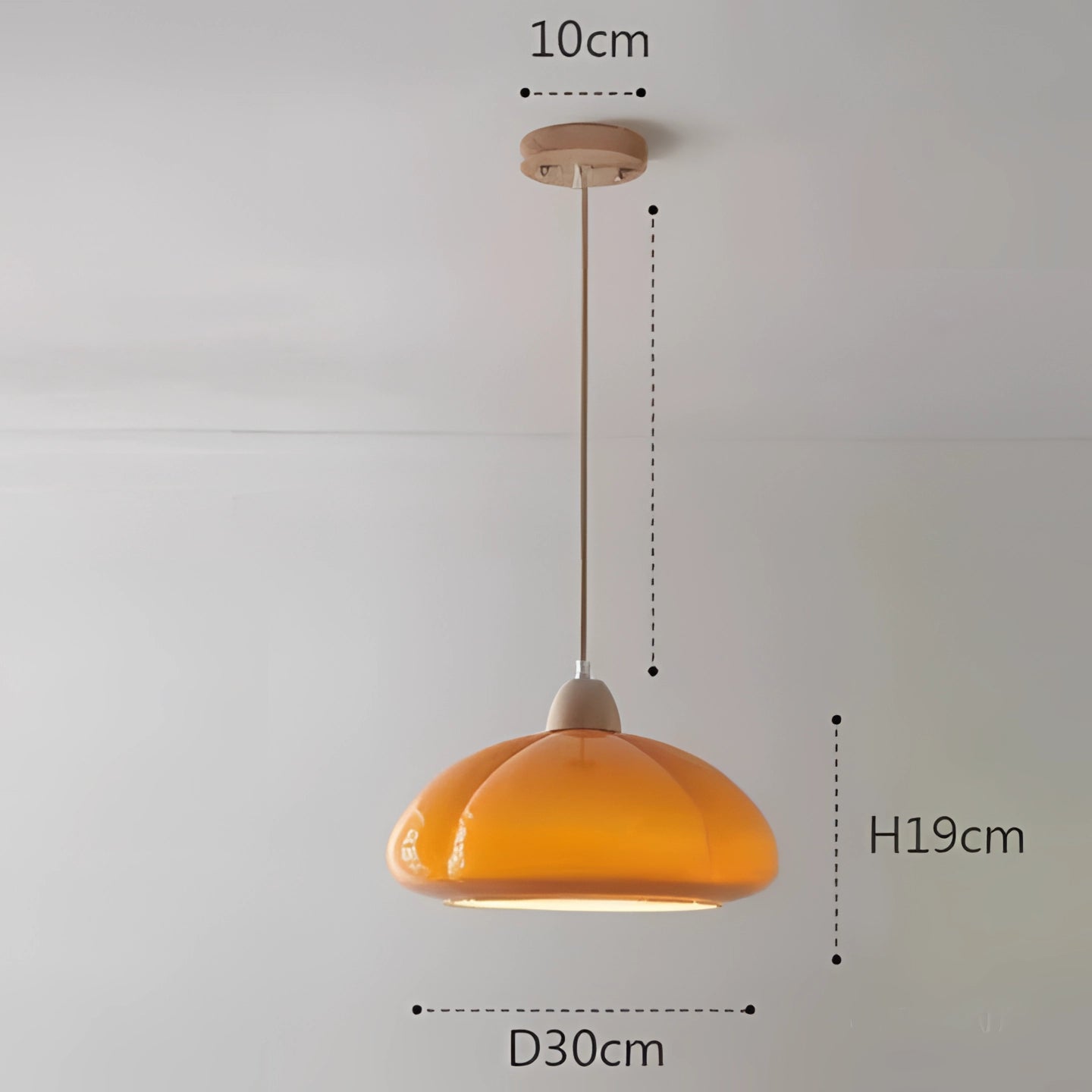 Modern orange pendant lamp with a warm white glow, featuring a circular metal design, hanging from the ceiling, suitable for home office and kitchen lighting.