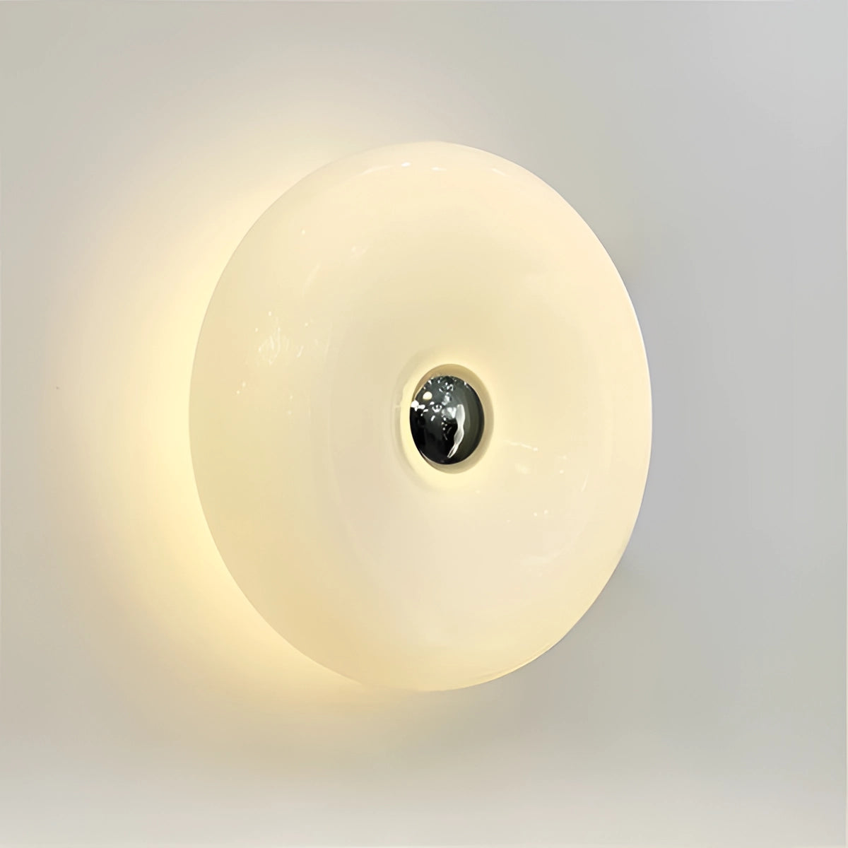 Modern orange wall sconce with a circular contemporary design, featuring a spherical light fixture, mounted on a wall.