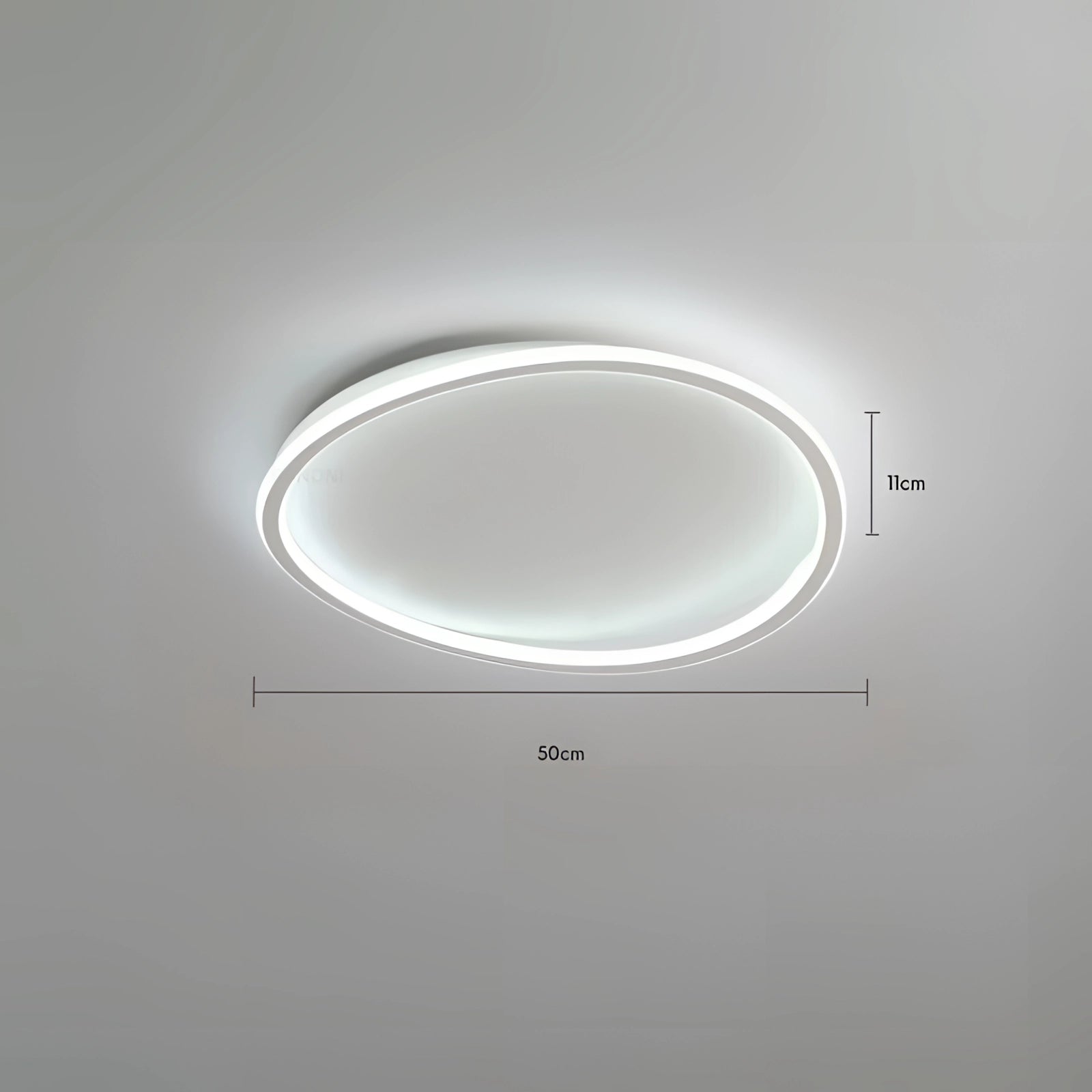 Modern oval LED ceiling light in white, 40cm size, mounted on a ceiling. The fixture features a minimalist design with a warm white glow, constructed from metal and aluminum materials, providing energy-efficient illumination.