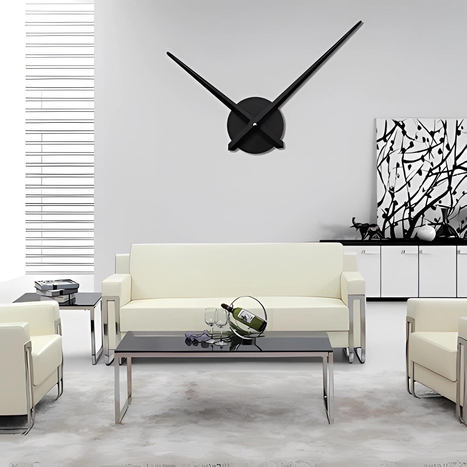 Modern oversized black wall clock mounted on a white wall, enhancing the minimalist decor of a stylish living room with a grey studio couch.