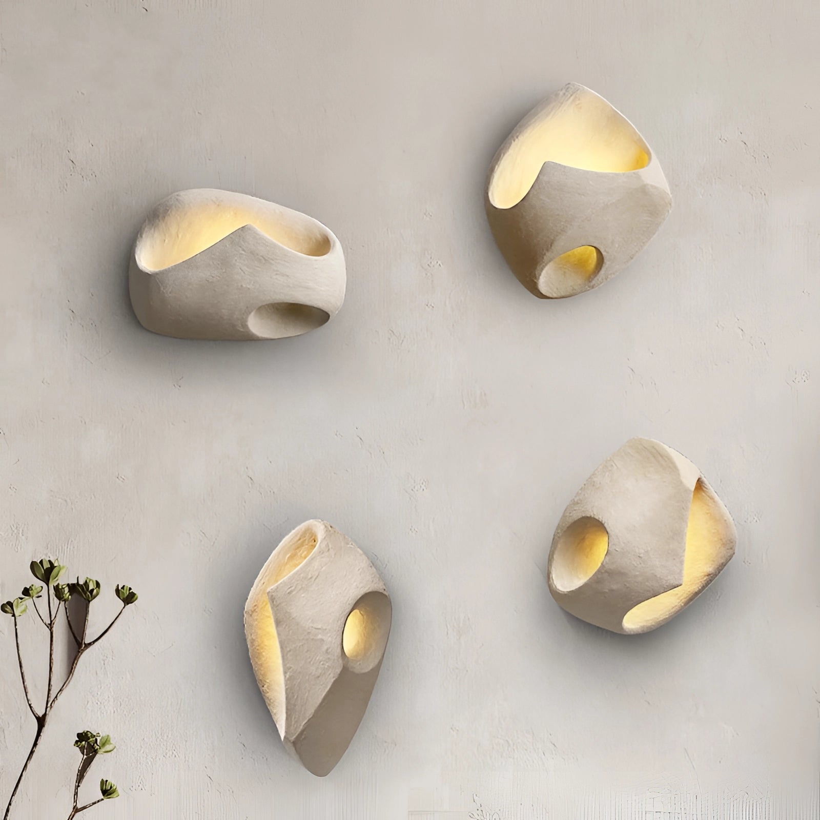 Modern pebble wall lamp with a stone-like appearance, featuring an oval shape and natural wood pattern, designed for indoor use.