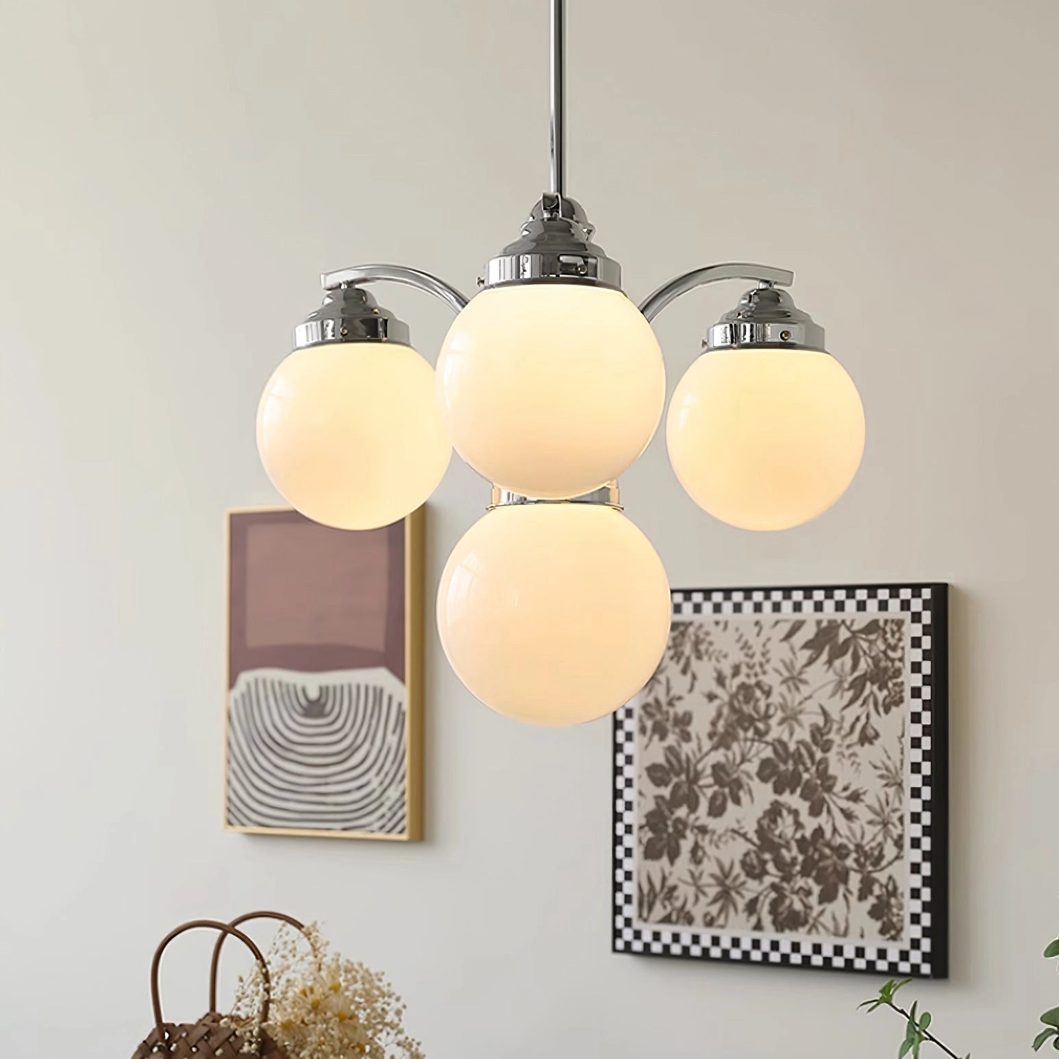 Elegant minimalist ceiling light featuring a modern pink glass chandelier with soft tints and shades, suspended from a wood fixture.